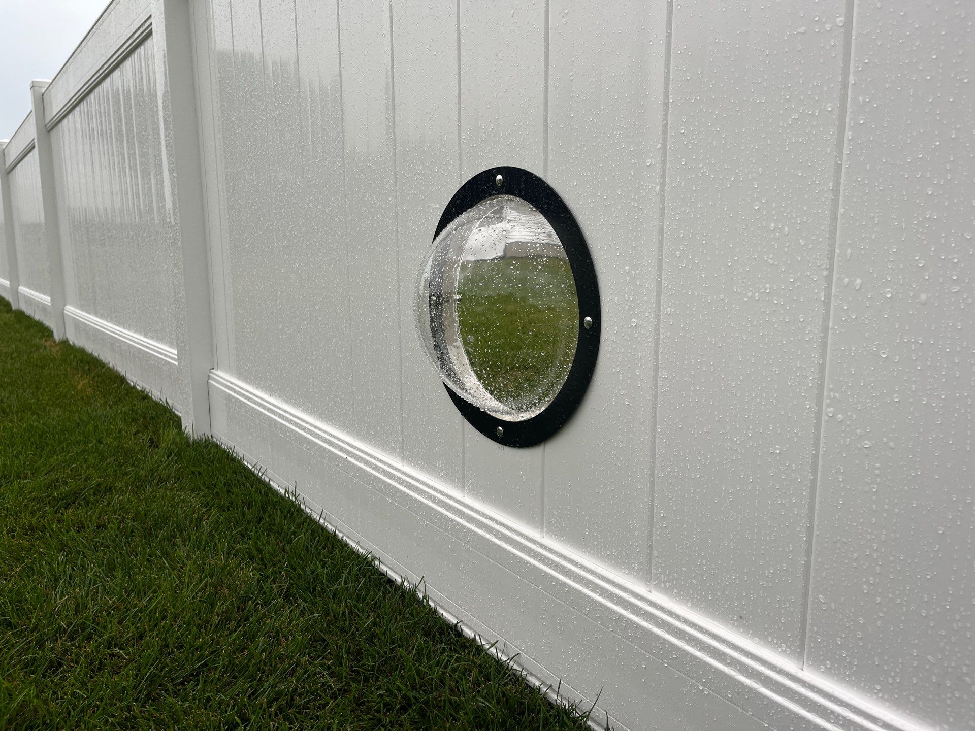 White Vinyl Privacy Fence With Pet Window in Cedar Falls by Perfect Picket Fence and Stain