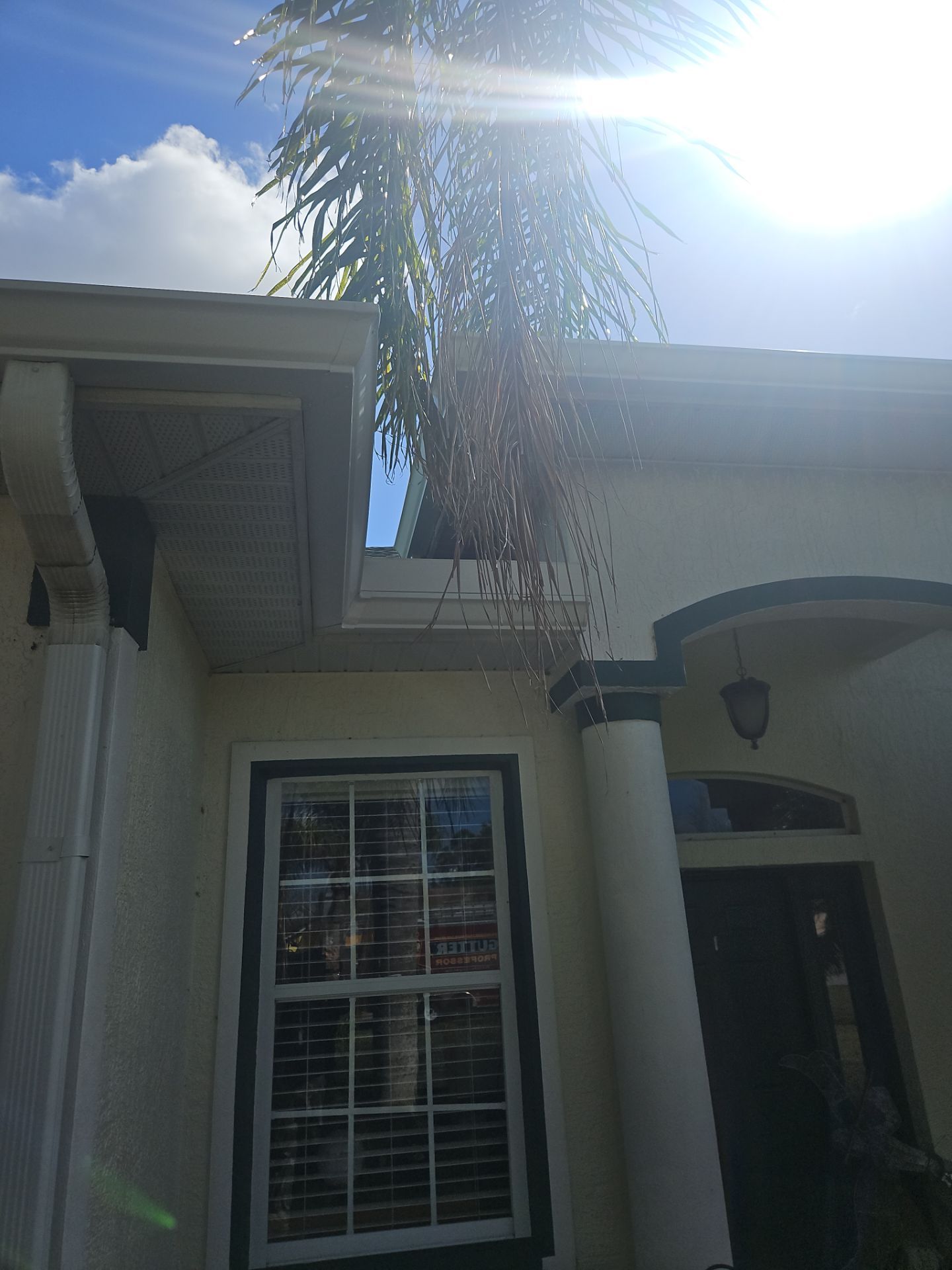 White seamless Gutters and downspout repair in Sarasota FL by Gutter Professors