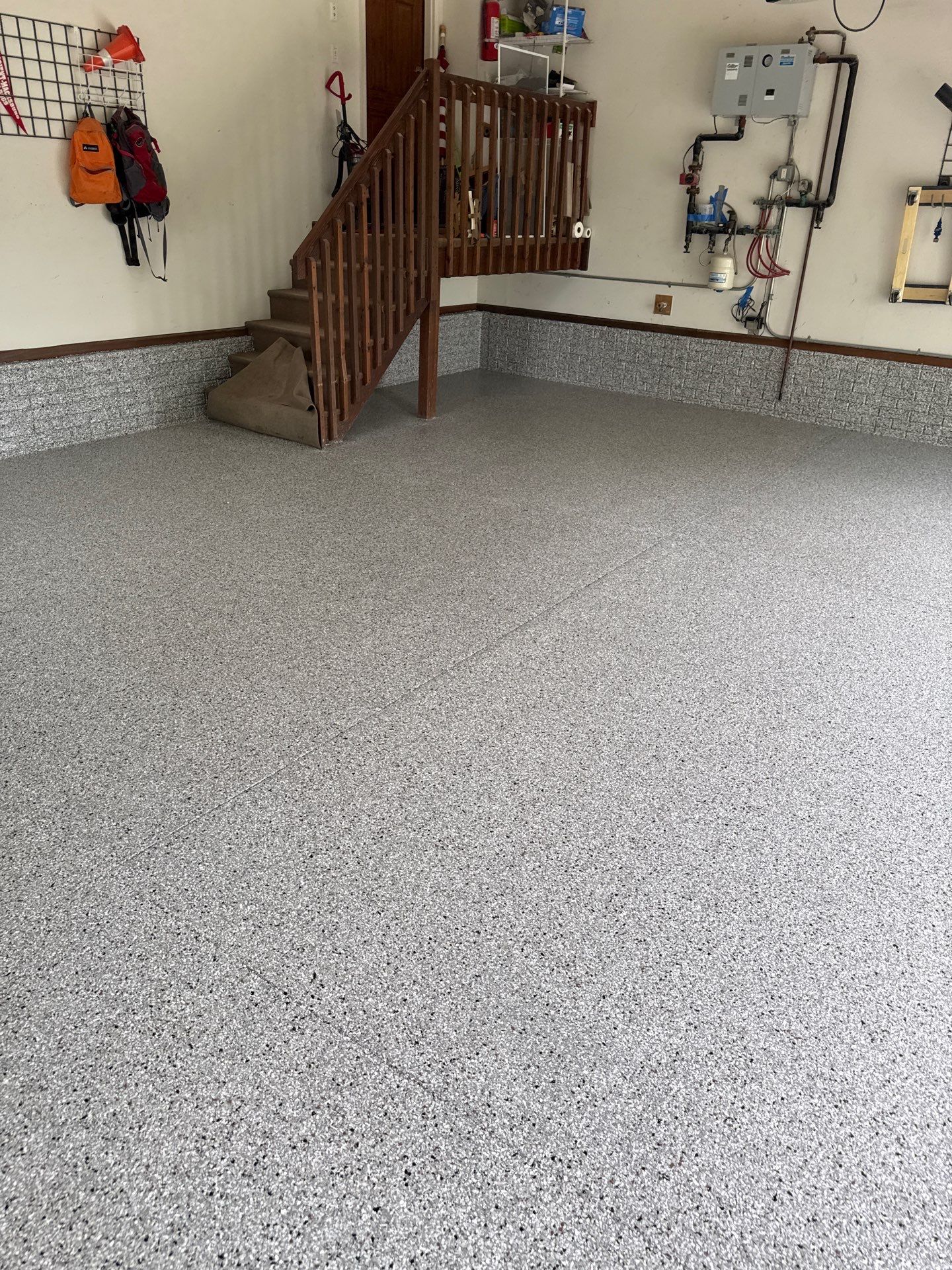 Coyote Flake Epoxy Garage Floor Coating in Earlham by Revival Concrete Coatings