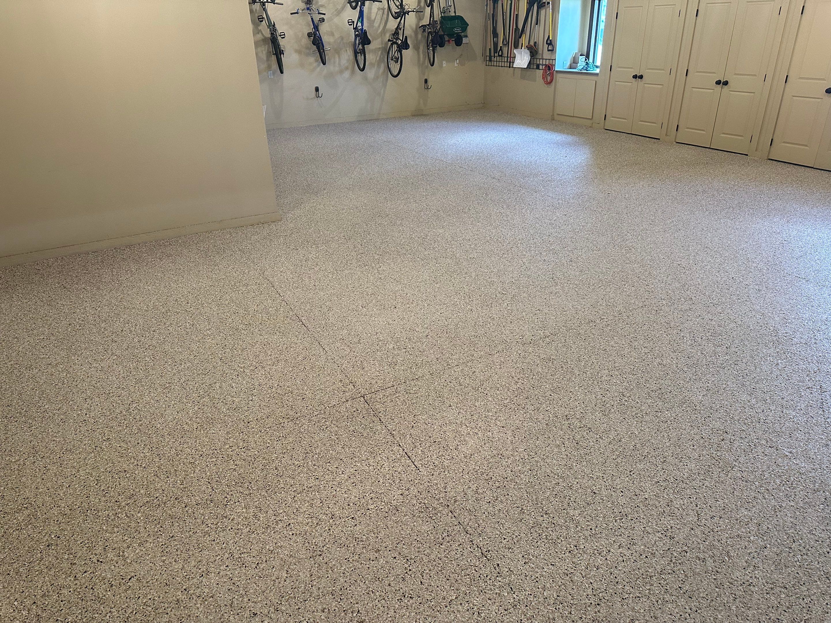 Sioux Falls Garage Floor Concrete Coating with Shoreline Flake Finish by Select Painting, Coatings & Garage Cabinets