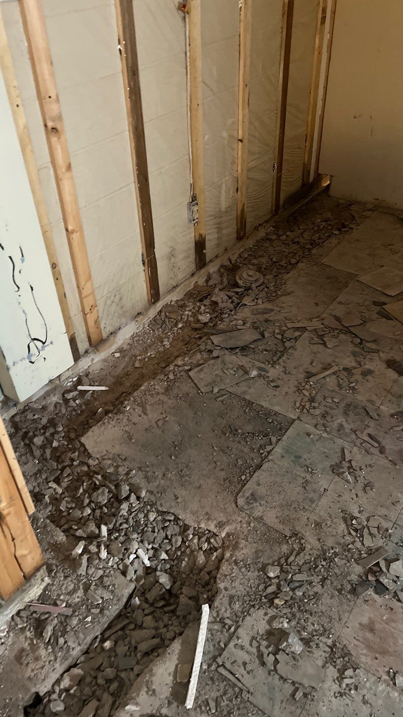 Interior drain tile system installation by ACE Waterproofing & Basement Solutions