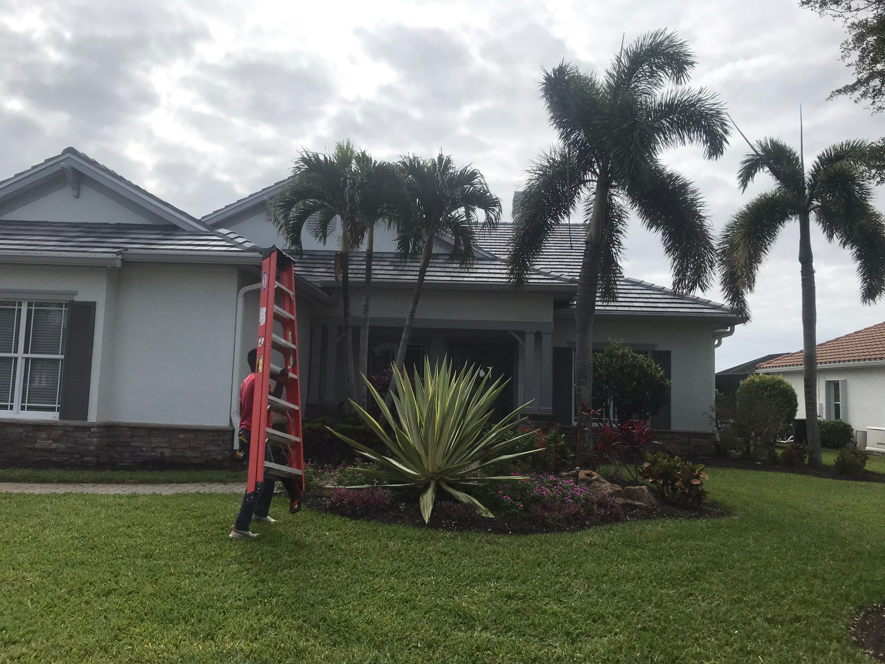 7-inch Grey Gutter Installation and White Downspouts in Fort Myers FL  by Gutter Professors