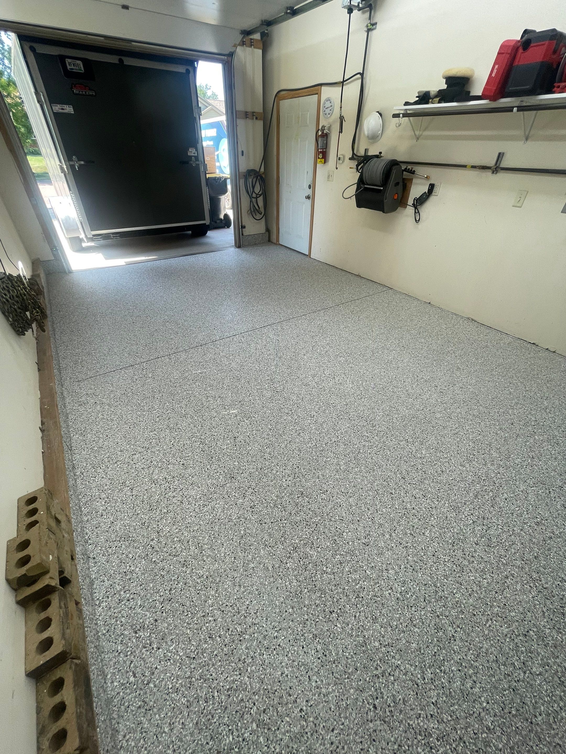 Multi-Stall Garage Floor Coating Installation in Sioux Falls by Select Painting, Coatings & Garage Cabinets