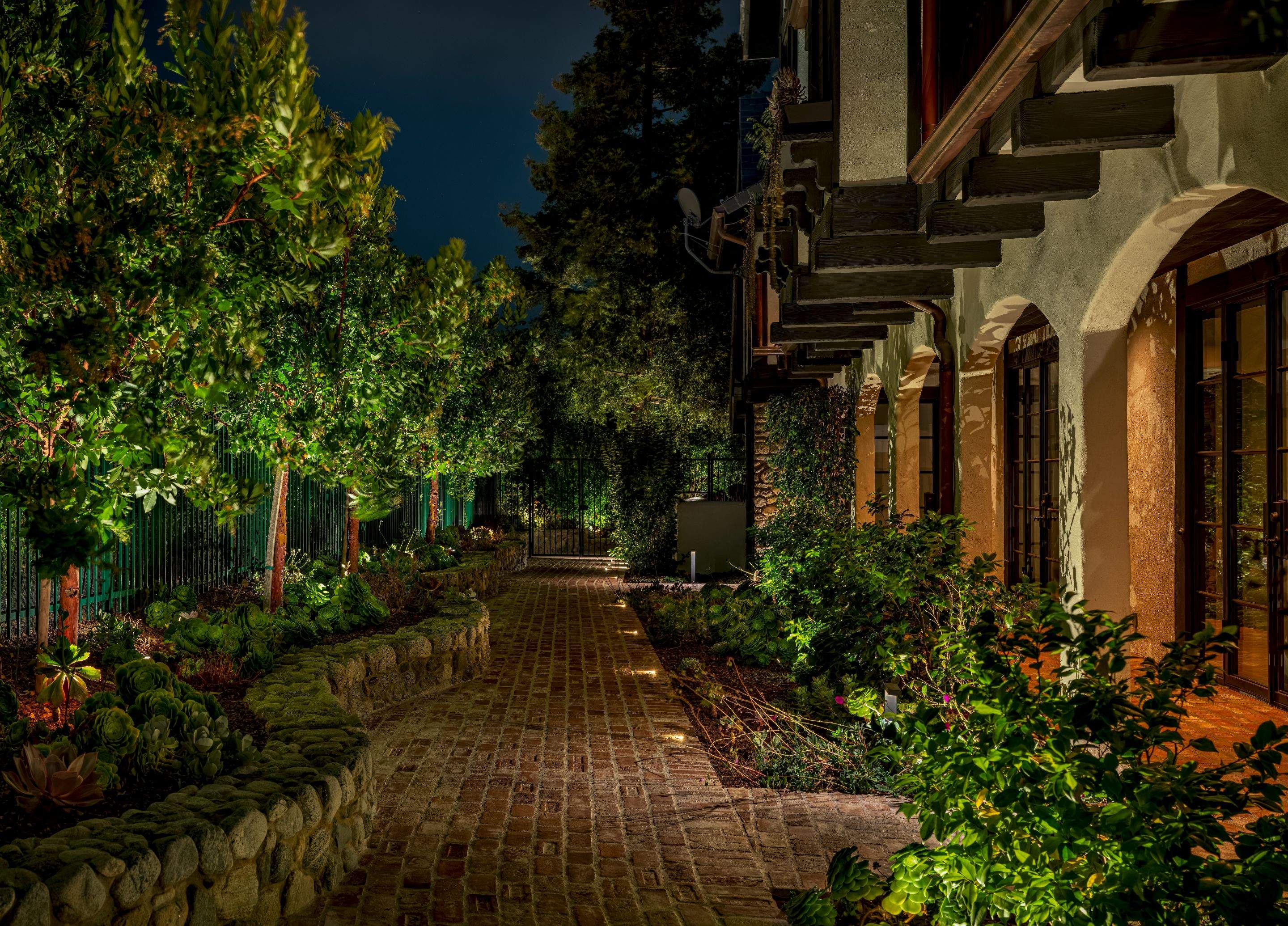 Tudor Estate Landscape Lighting with Integrated Stone Step Illumination by Outdoor Lights + Shades