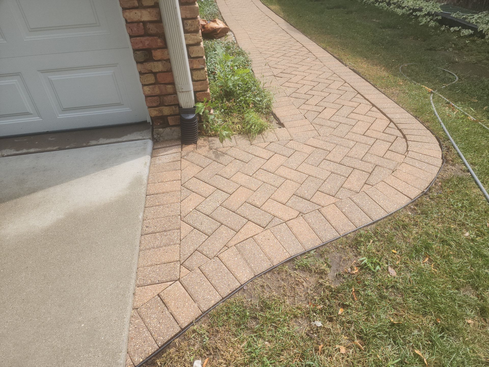 Arlington Heights Brick paver repair, cleaning and sealing by Northern Power Washing LLC.
