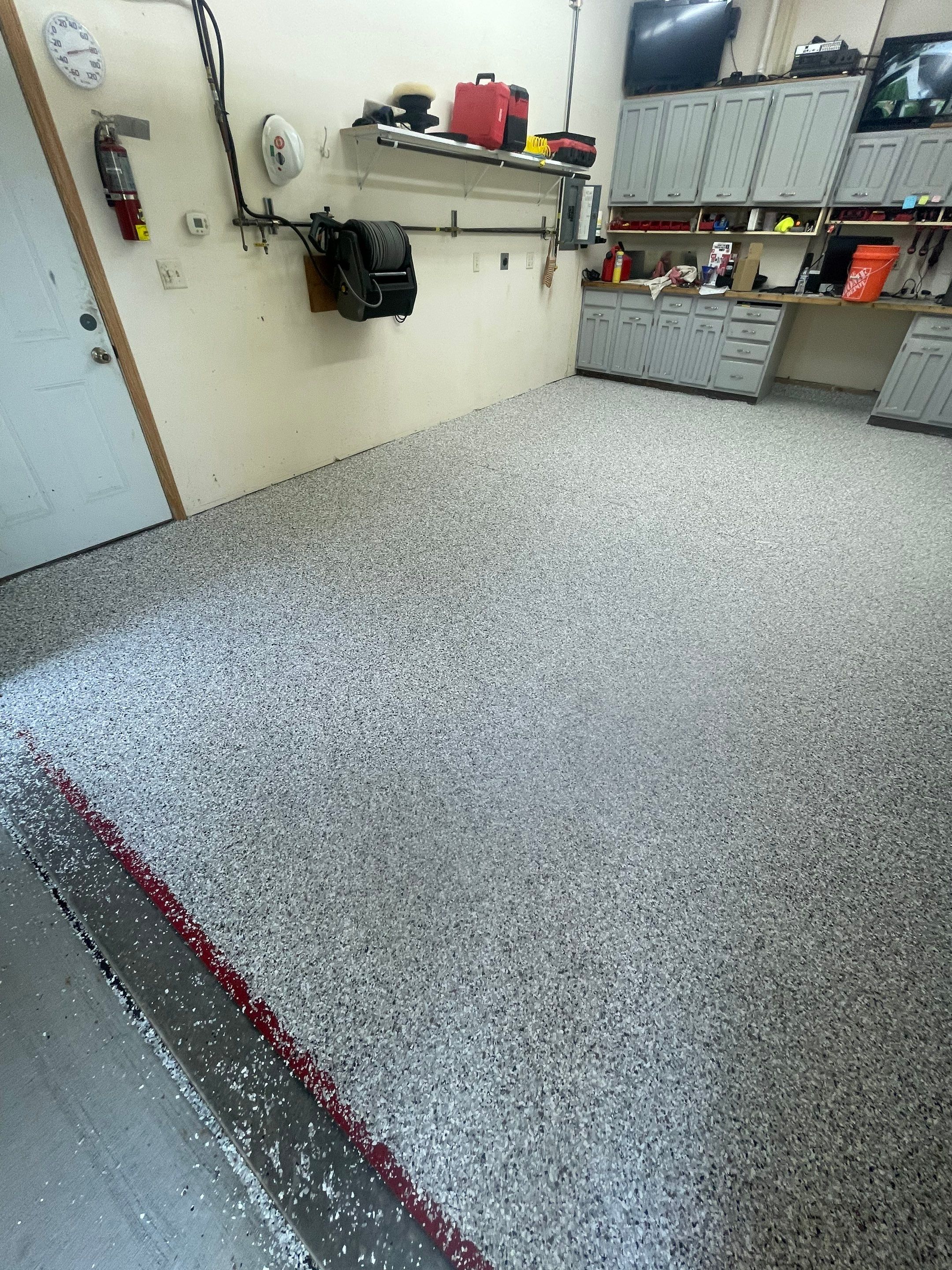 Multi-Stall Garage Floor Coating Installation in Sioux Falls by Select Painting, Coatings & Garage Cabinets