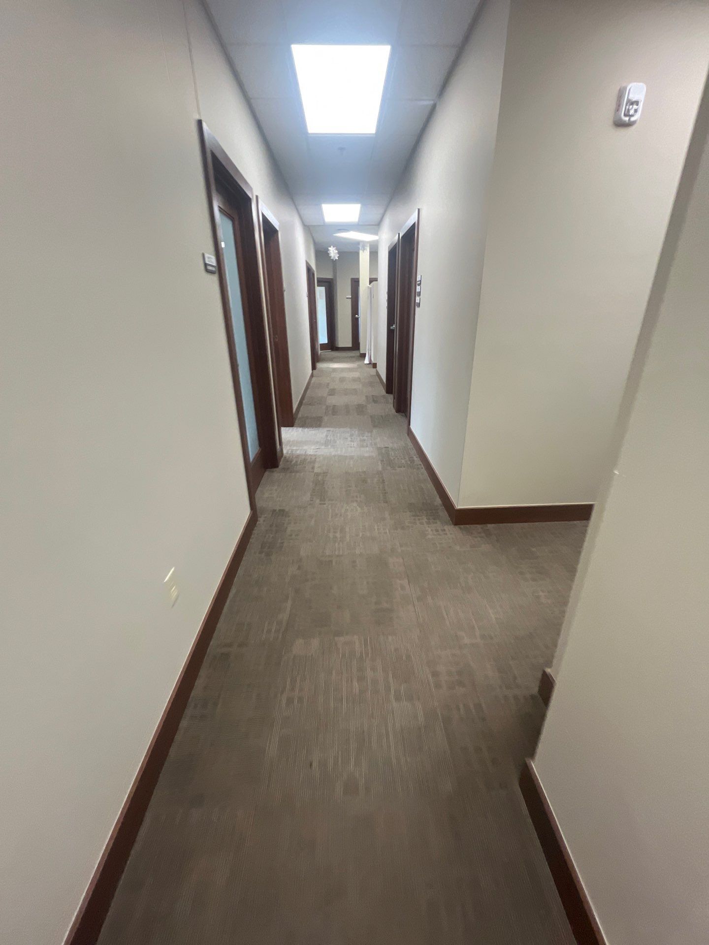 Commercial Office Interior Remodel and Modern Suite Refresh in Sioux Falls by Select Painting, Coatings & Garage Cabinets