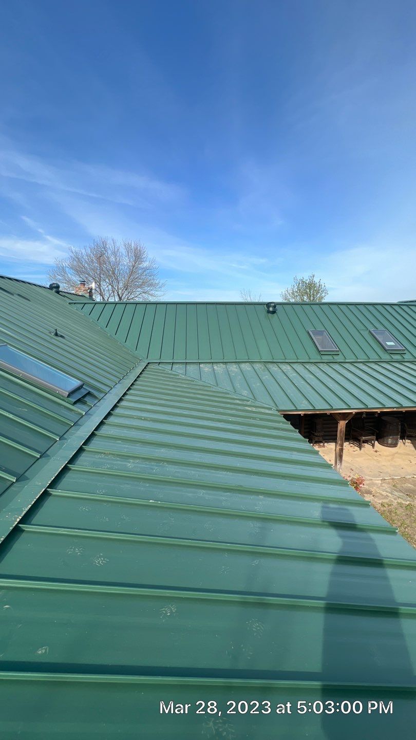 Shingle to Standing Seam Metal Roof by Springtree Restoration