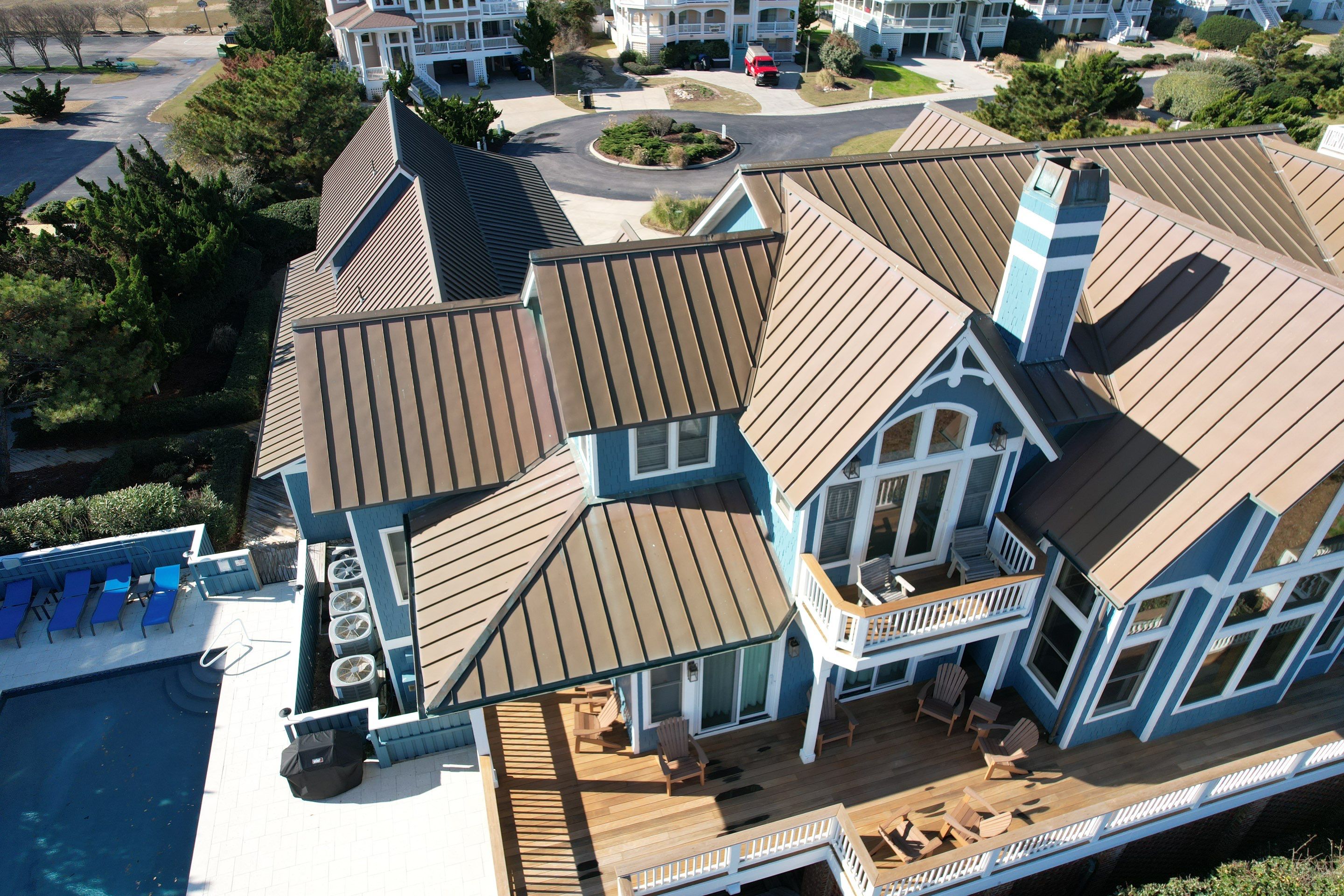 Large Metal Roof Transformation by Gallop Roofing & Remodeling, Inc.