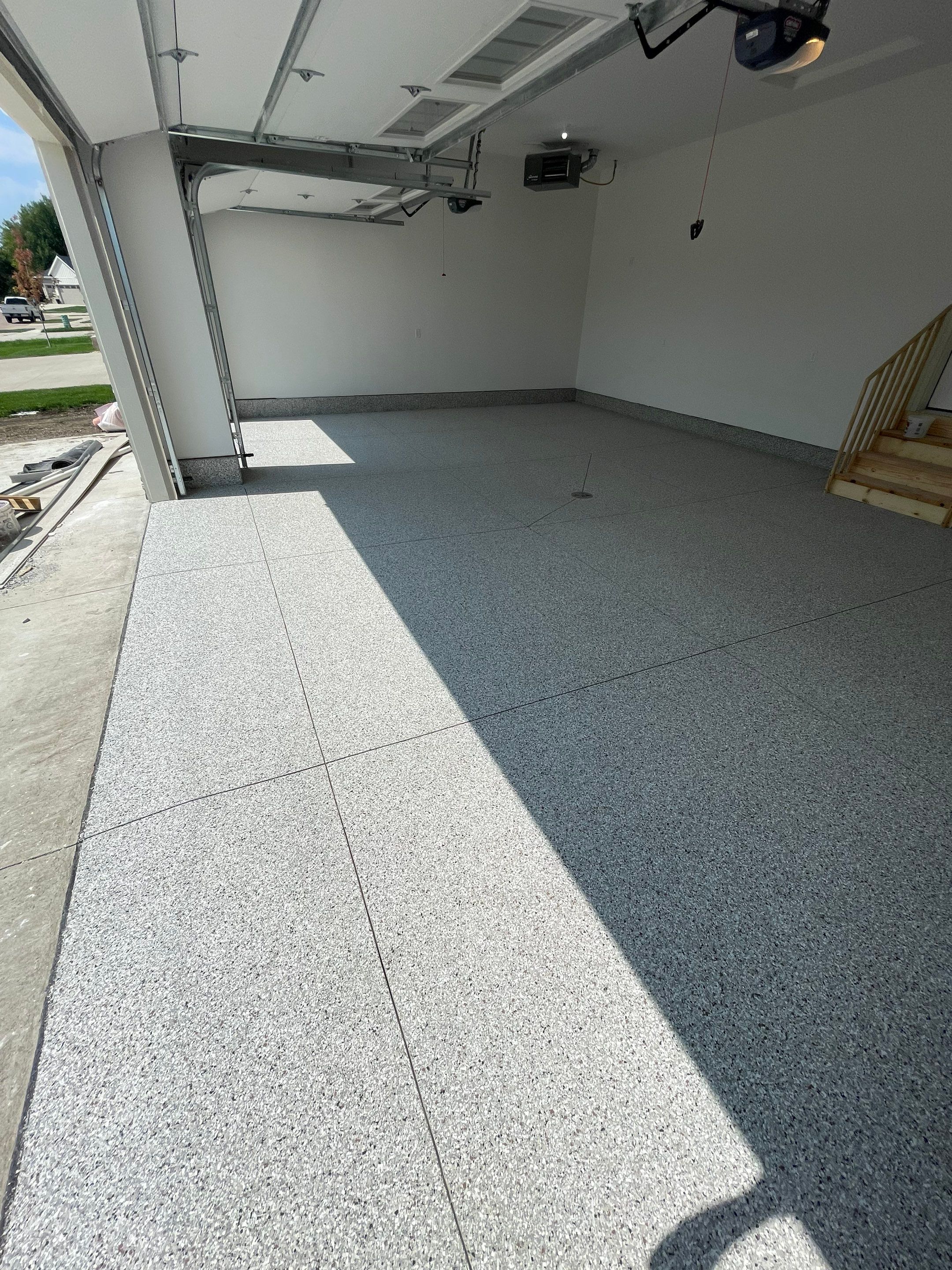 Grey Speckled Garage Floor Coating in Sioux Falls by Select Painting, Coatings & Garage Cabinets