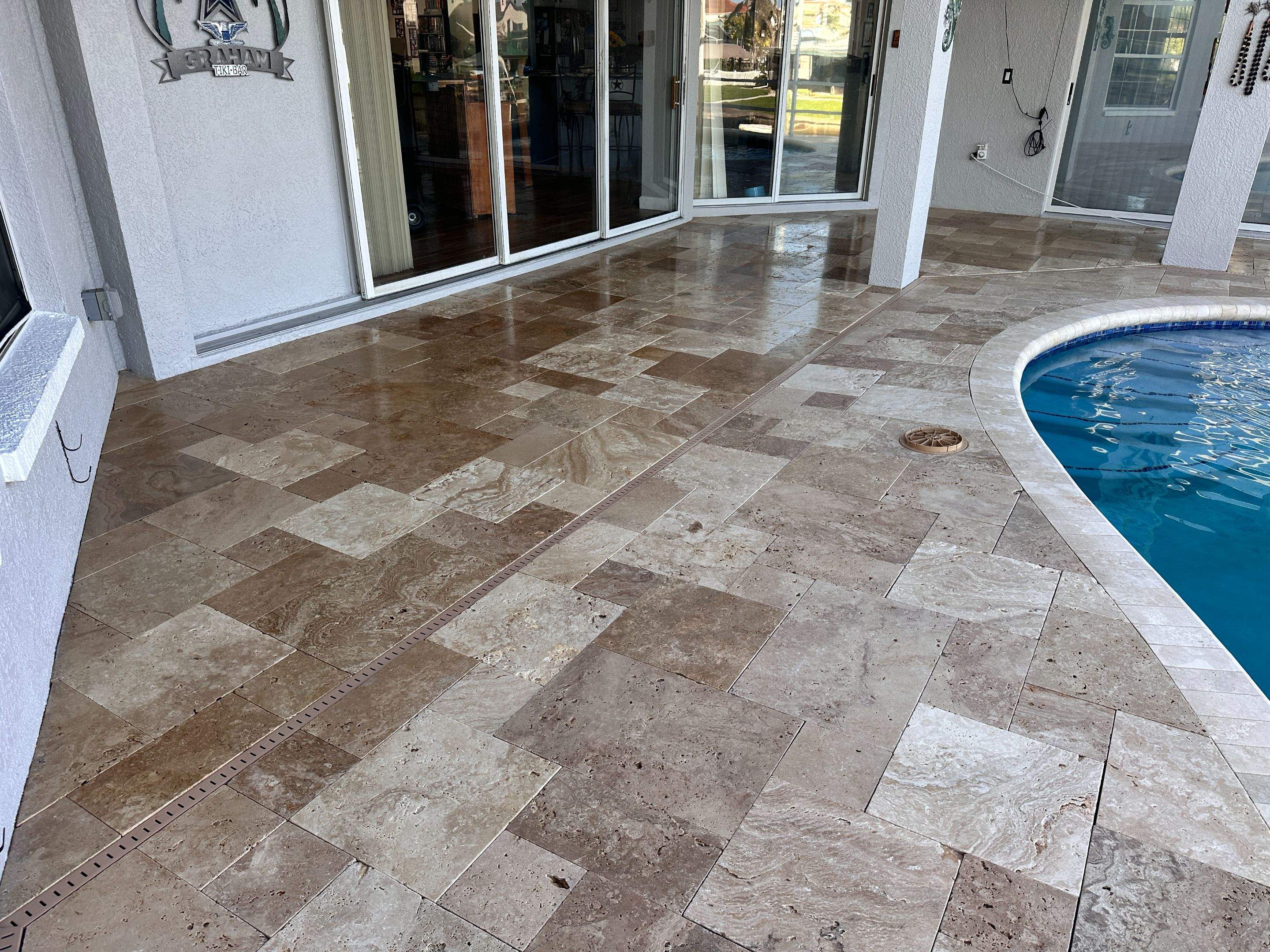Travertine Sealing and Stripping for a Waterfront Pool Deck in Apollo Beach by Supreme Paver Experts