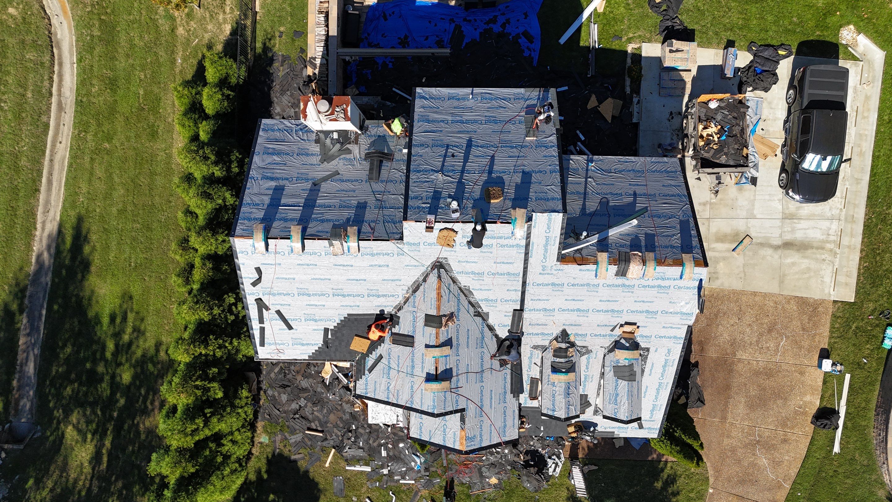 Charcoal Black Re-Roof & Gutters by Royal House LLC