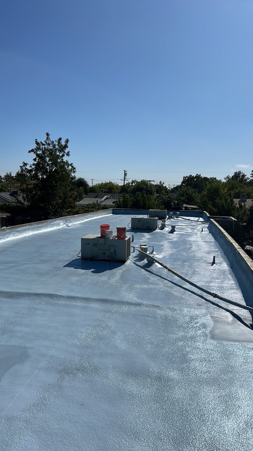 Foam Refurbish using Conklin Benchmark/PUMA XL coatings and spray foam; Also metal roofing around parapet wall by Straight Edge Roofing Inc