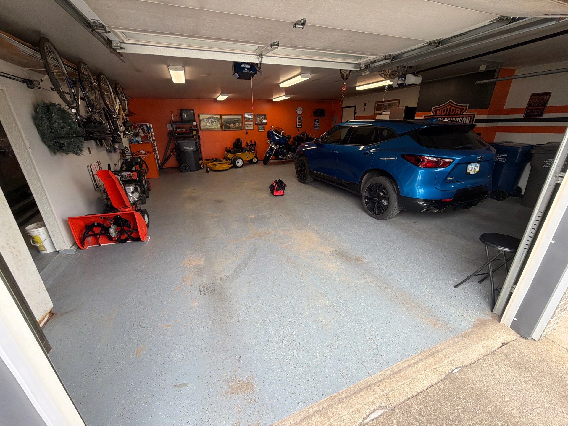Custom Grey Flake Epoxy Garage Floor Installation in Remsen by Select Painting, Coatings & Garage Cabinets