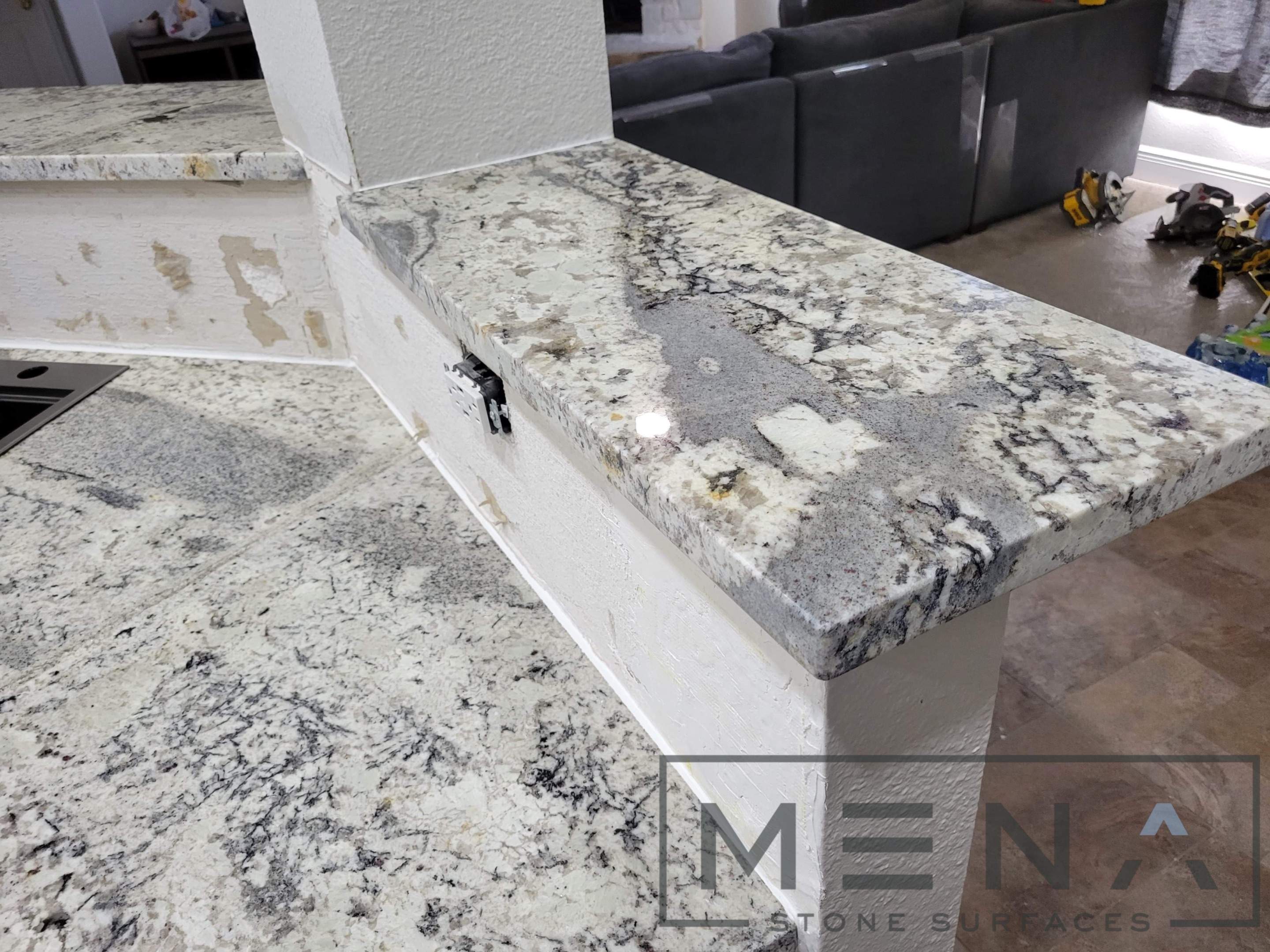 Kitchen countertops using Alaska Blue Granite by Mena stone surfaces