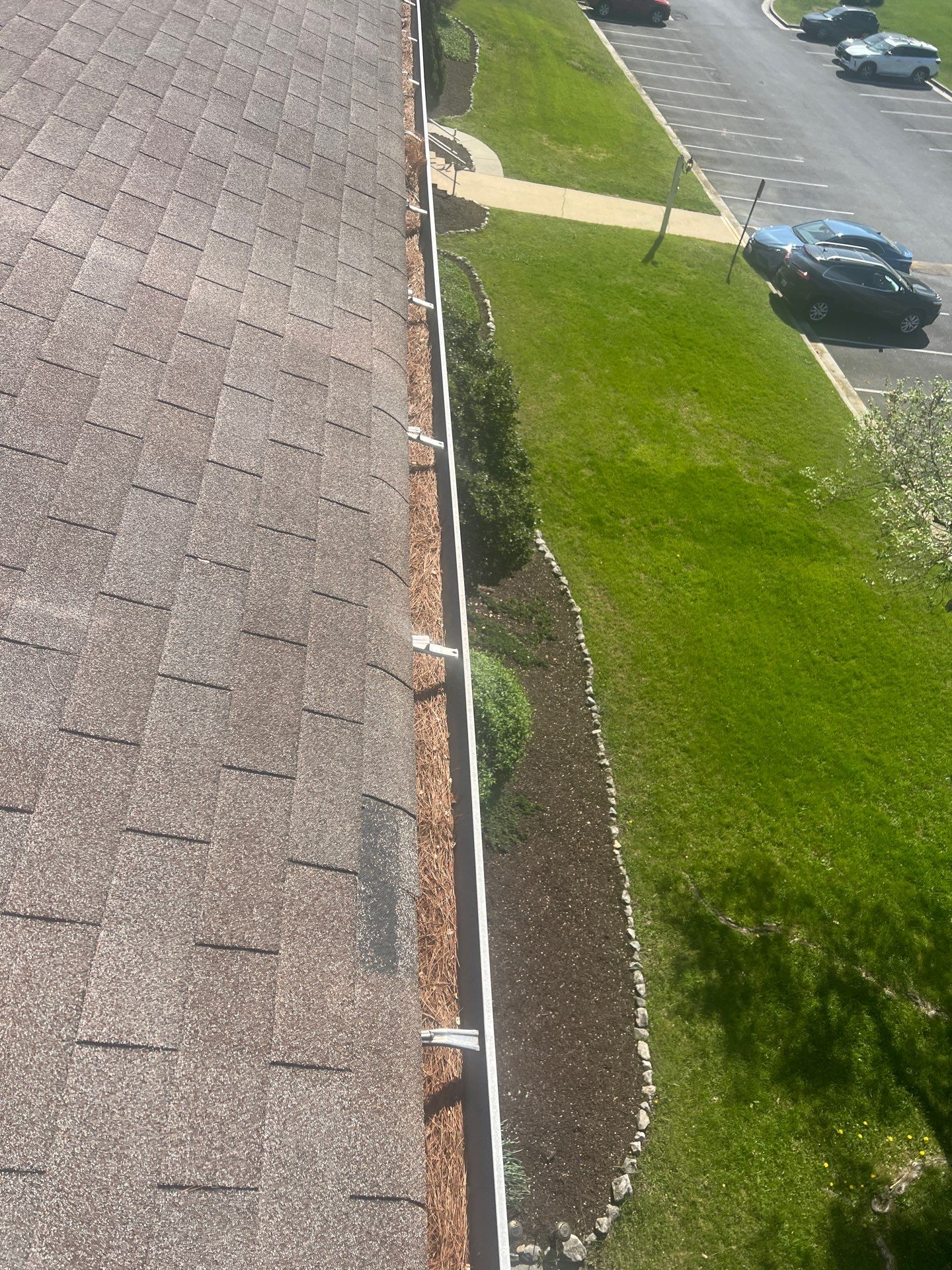 Commercial gutter cleaning Georgia before photo with filled gutters