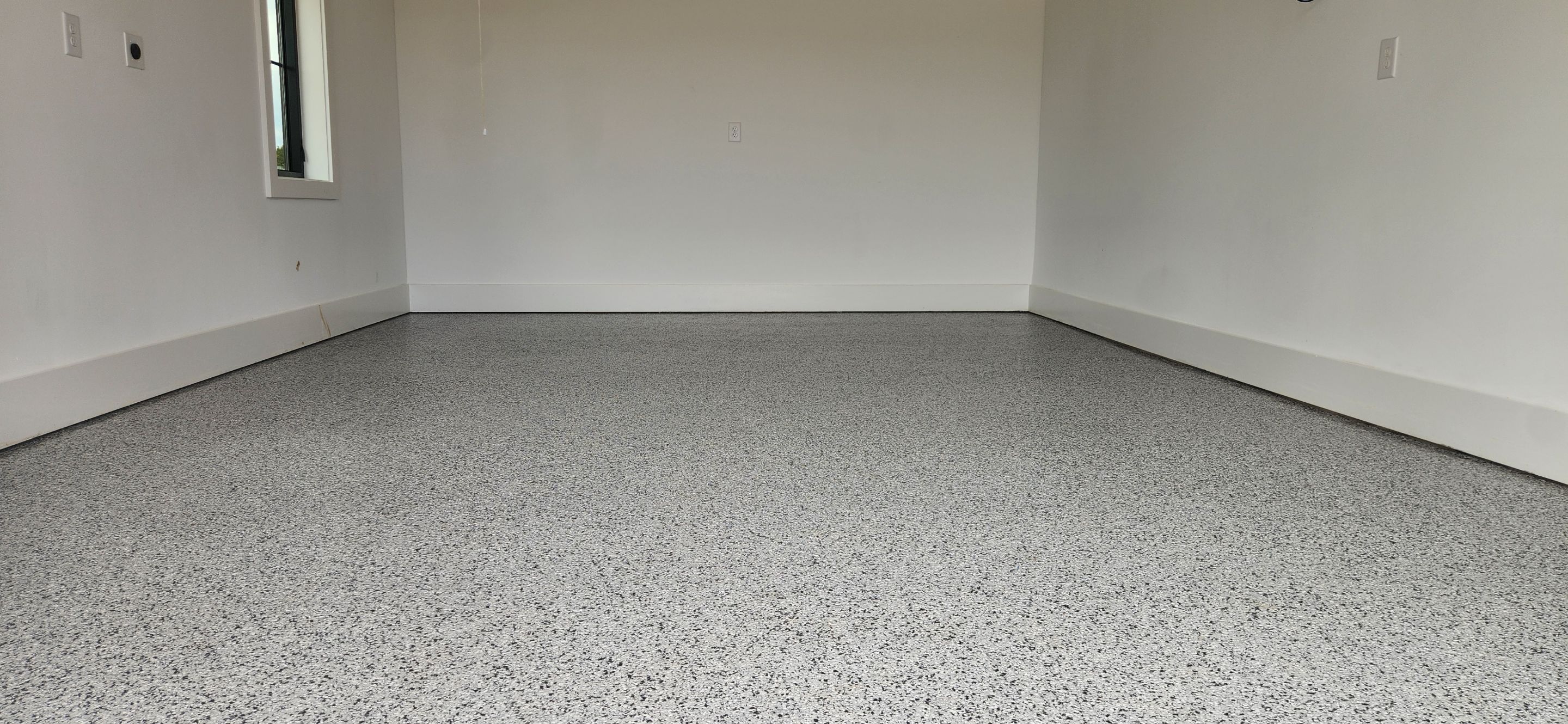 Garage Transformation Using Houndstooth by Elite Floor Solutions
