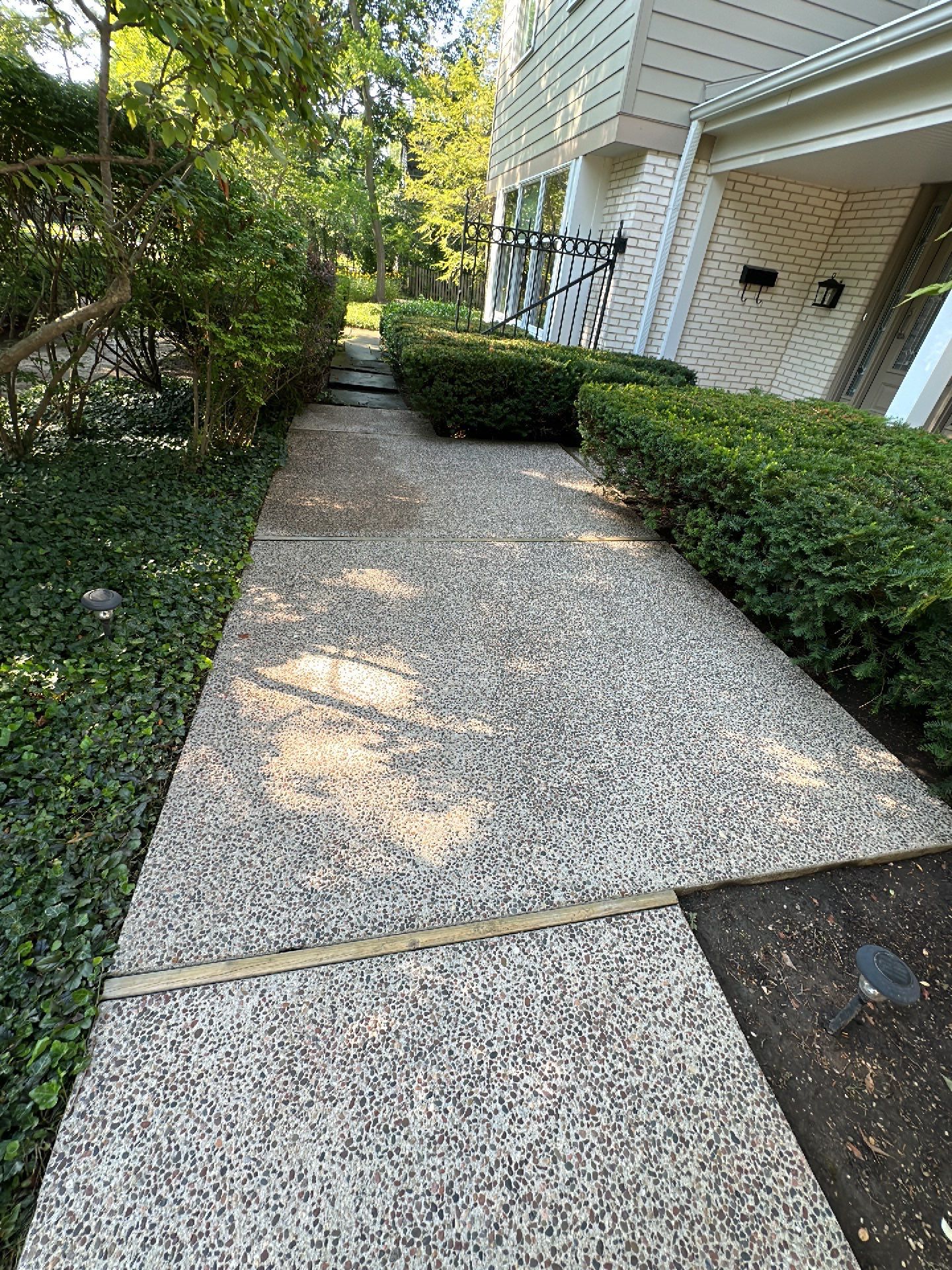 Aggregate concrete cleaning and sealing using Surebond SB-9000 by Northern Power Washing LLC.