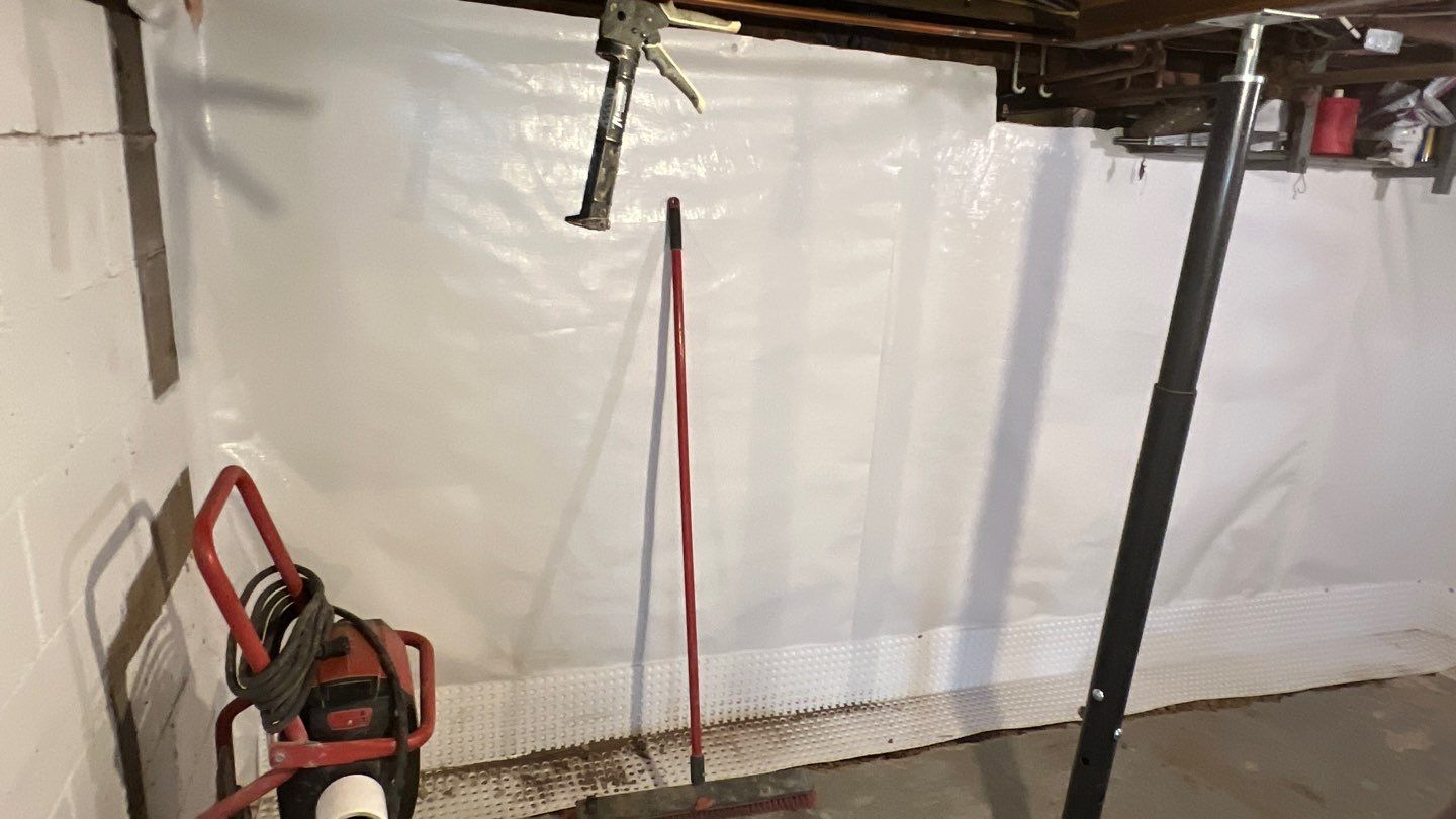 Basement Waterproofing using Drain tile system and a foundation wrap by ACE Waterproofing & Basement Solutions