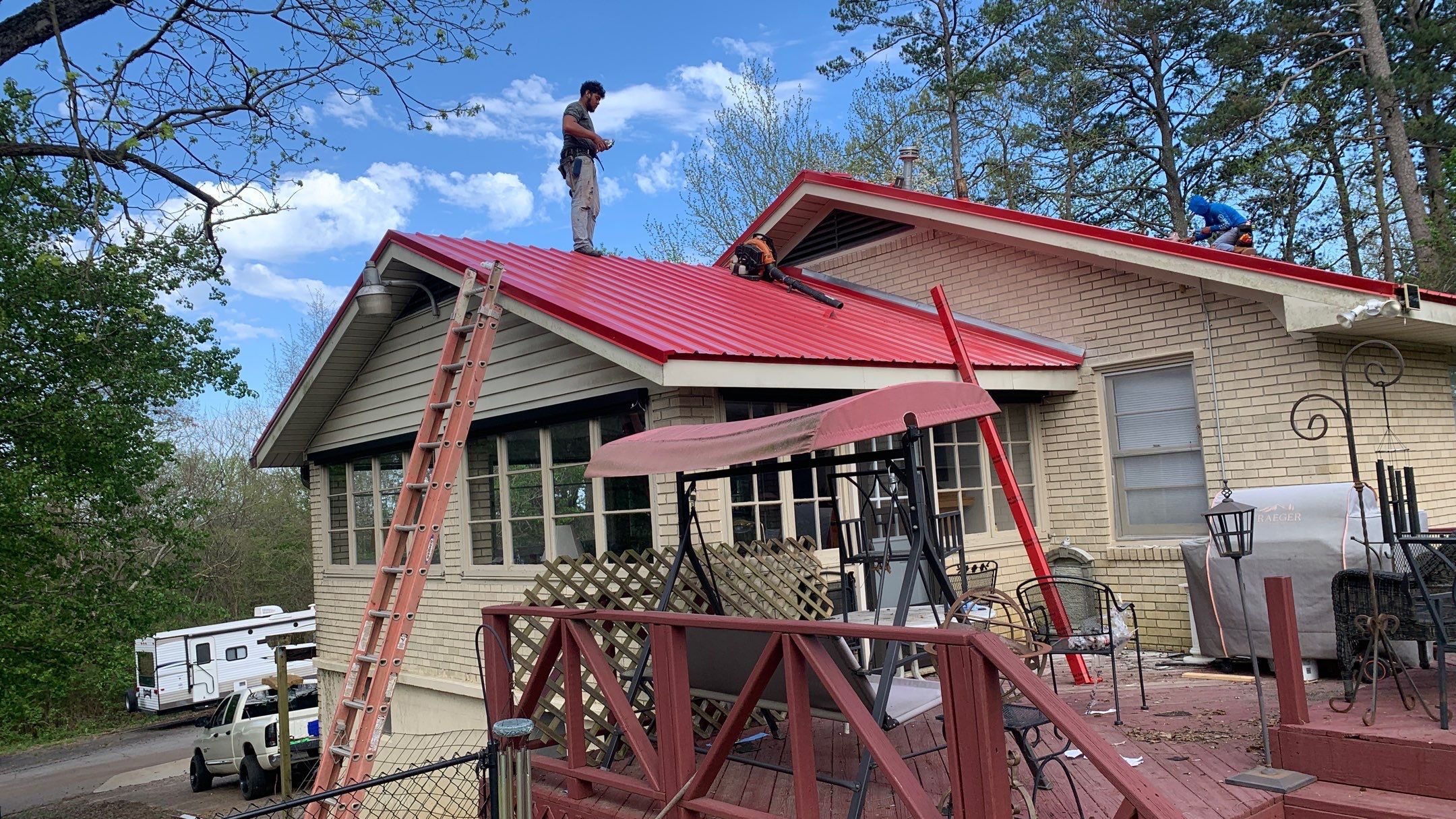 Residential Roofing Installation using 26 Gauge Colored Panels by Hostetler Roofing
