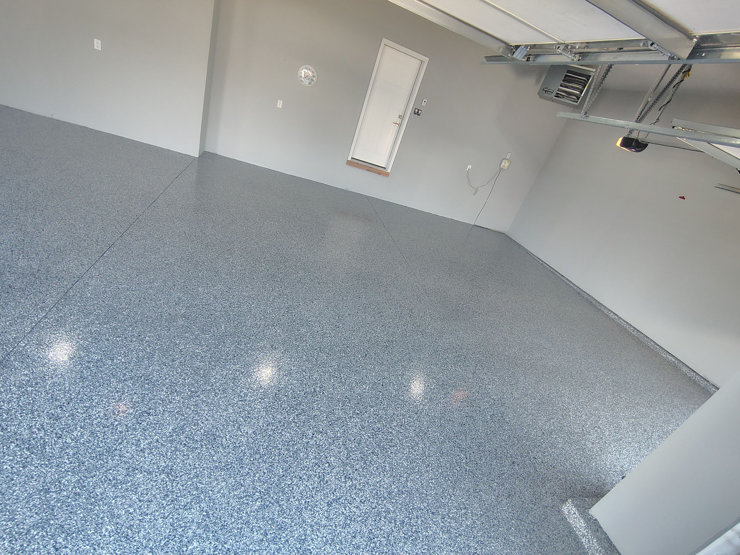 Sioux Falls Garage Floor with Domino Flake by Select Painting, Coatings & Garage Cabinets