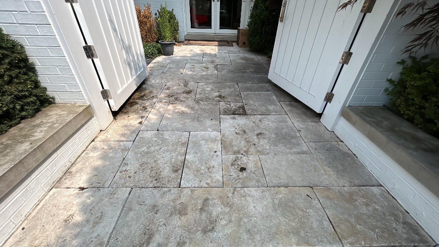 marble patio cleaning and sanding using Polysweep polymeric sand by Northern Power Washing LLC.