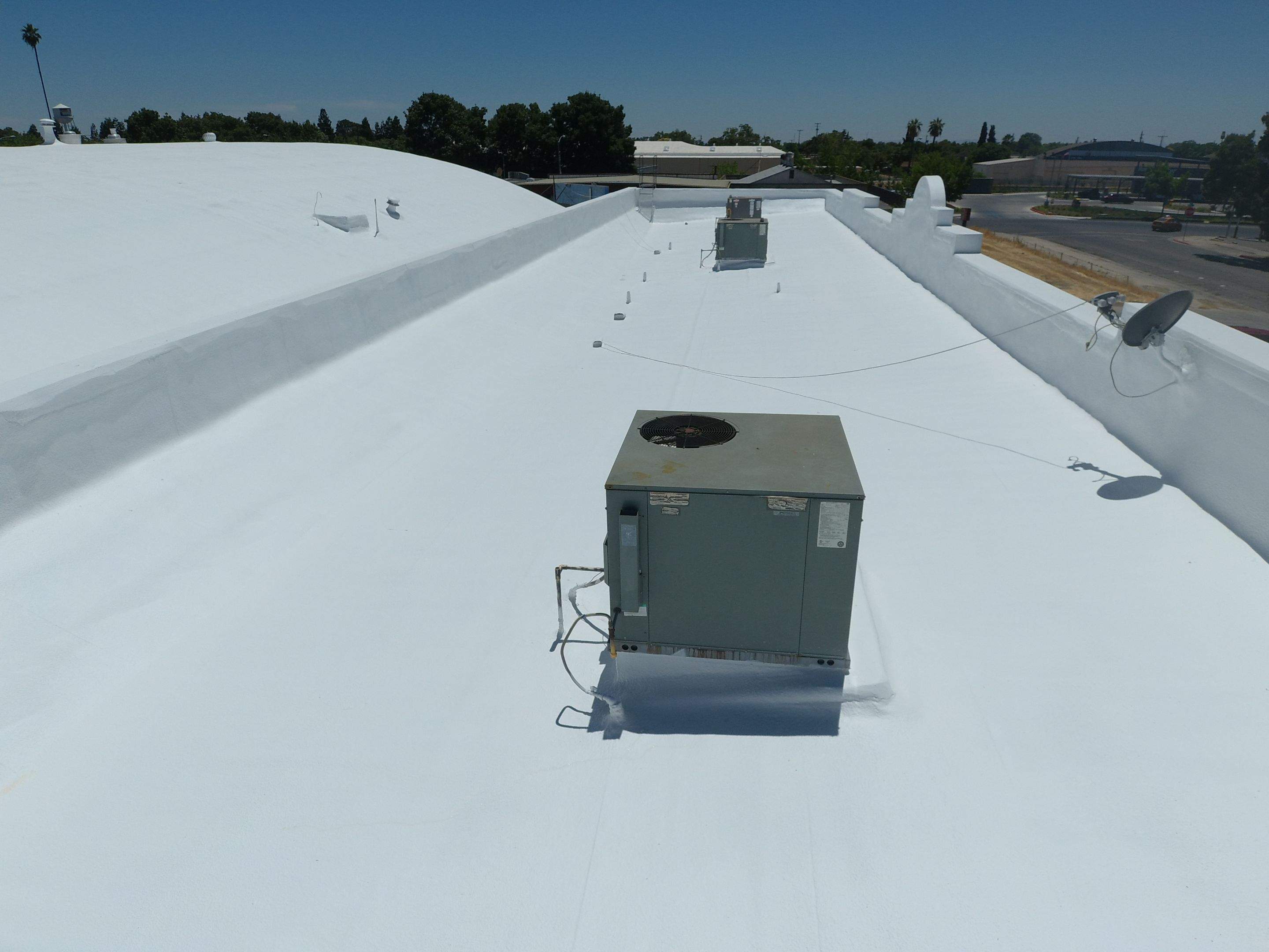 Spray foam and coatings using Conklin Benchmark/PUMA XL coatings and spray foam by Straight Edge Roofing Inc