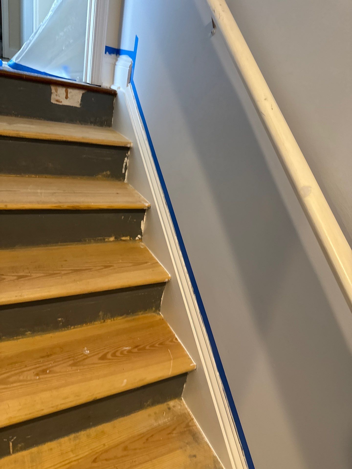 Stairway Installation using t vinyl stair tread and reversibleriser by La Bendicion Contruction Llc