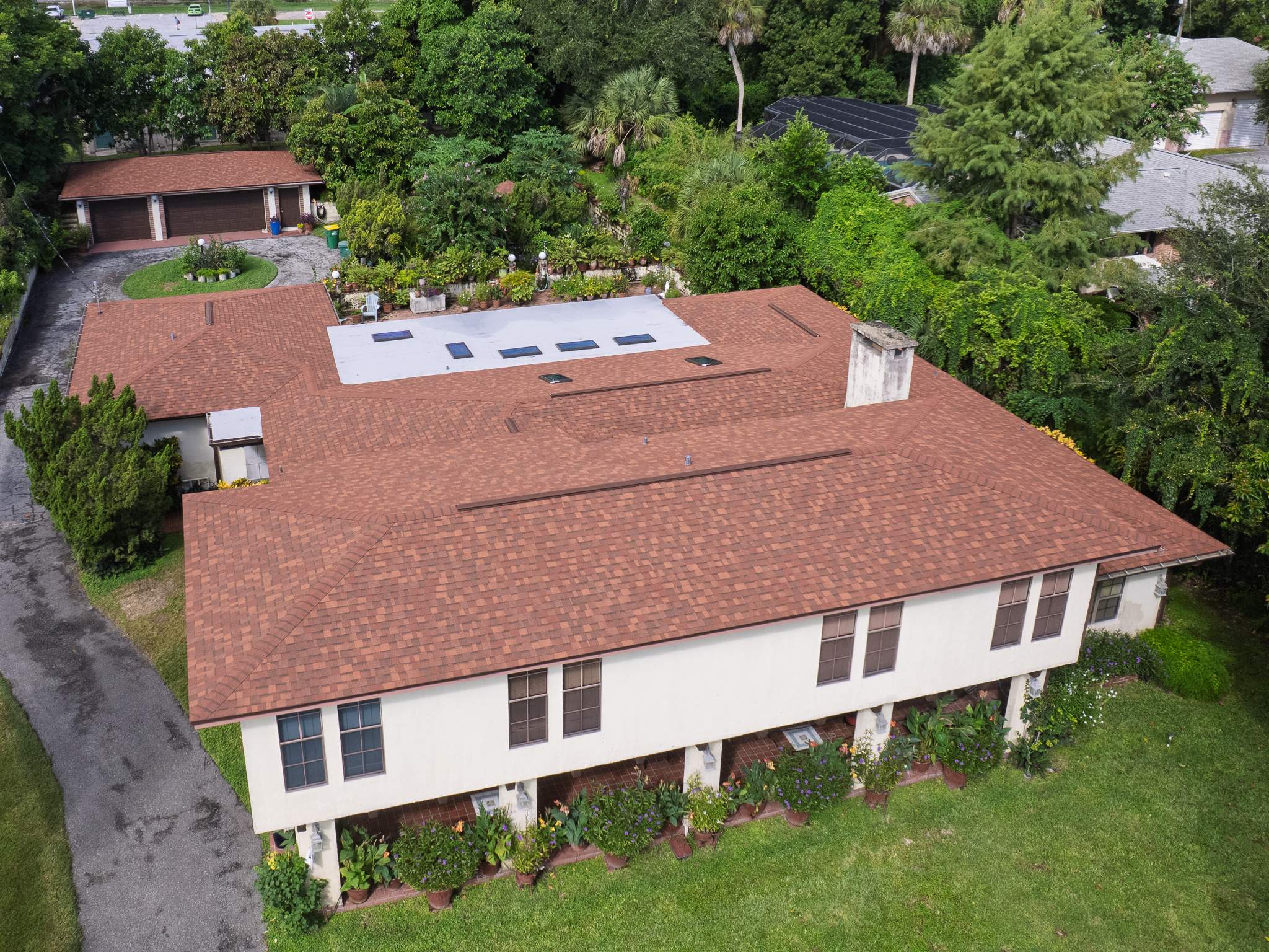 Cocoa Residential Roof Replacement Featuring Integrated Skylights and Flat Roofing by Wiedmann Construction & Roofing