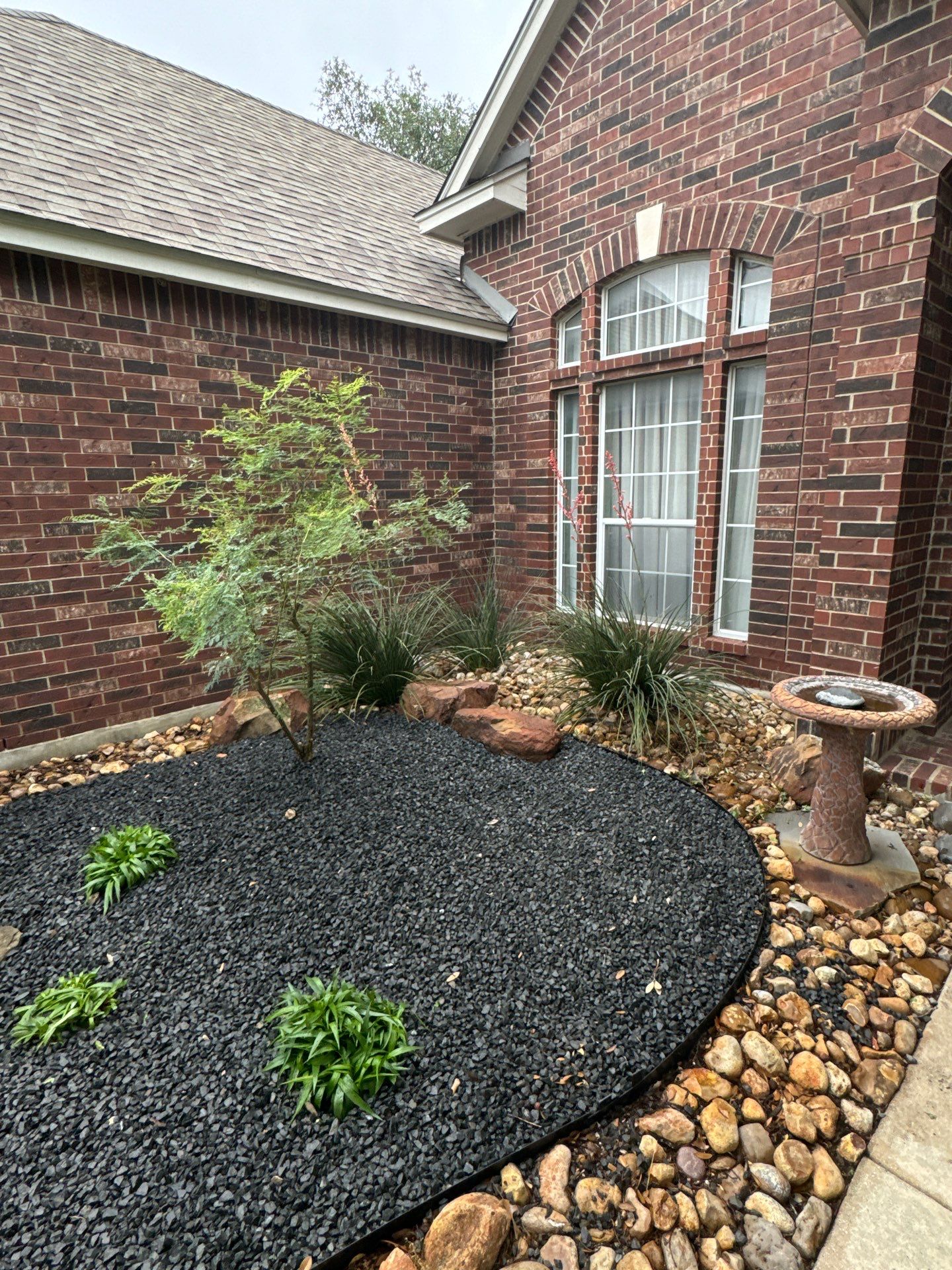 Landscaping Enhancement  using Texas Black Gravel by Hole In One Lawns, LLC