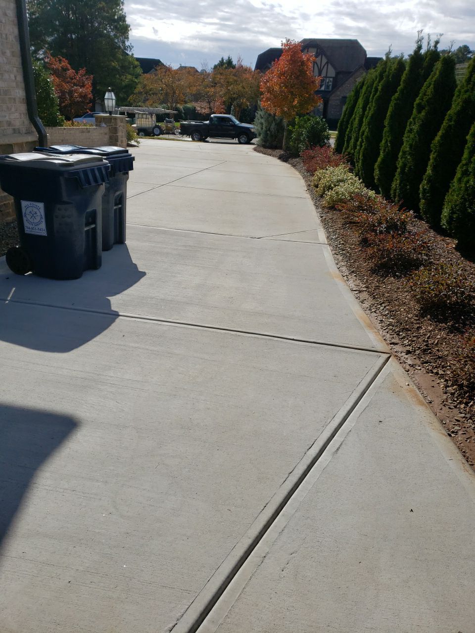 Driveway Clean using cleaner by Power Wash Masters LLC