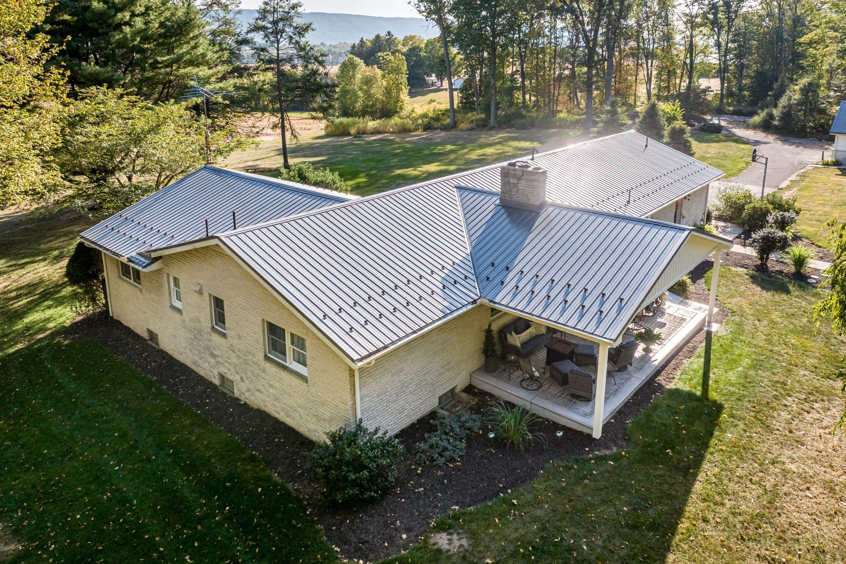Metal Roof and Gabled Porch Addition in Hegins by Esh Builders