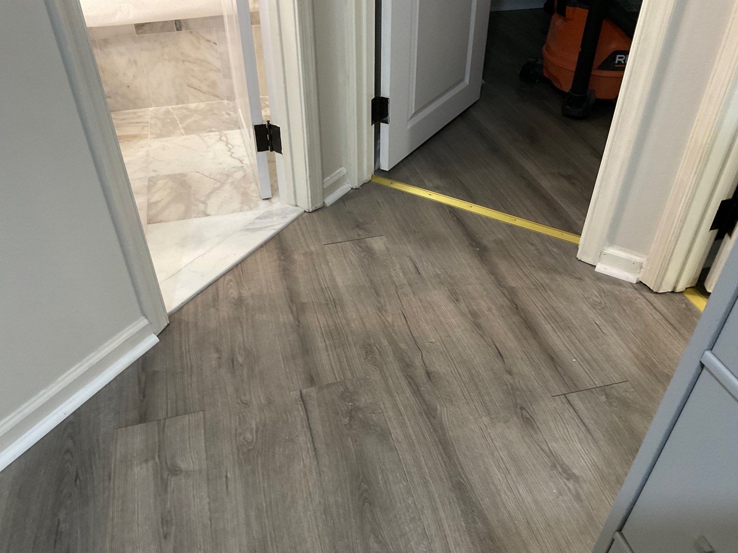 Bathroom Remodel using Two new bathroom design and new floors by Alpha Design Services