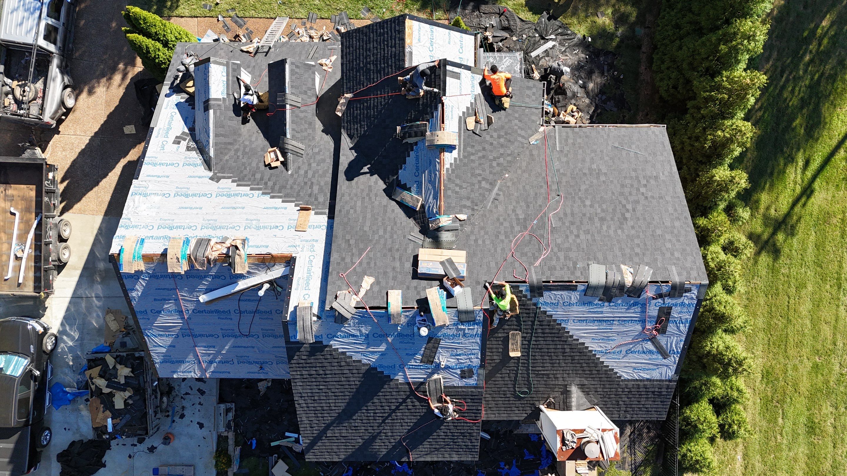 Charcoal Black Re-Roof & Gutters by Royal House LLC