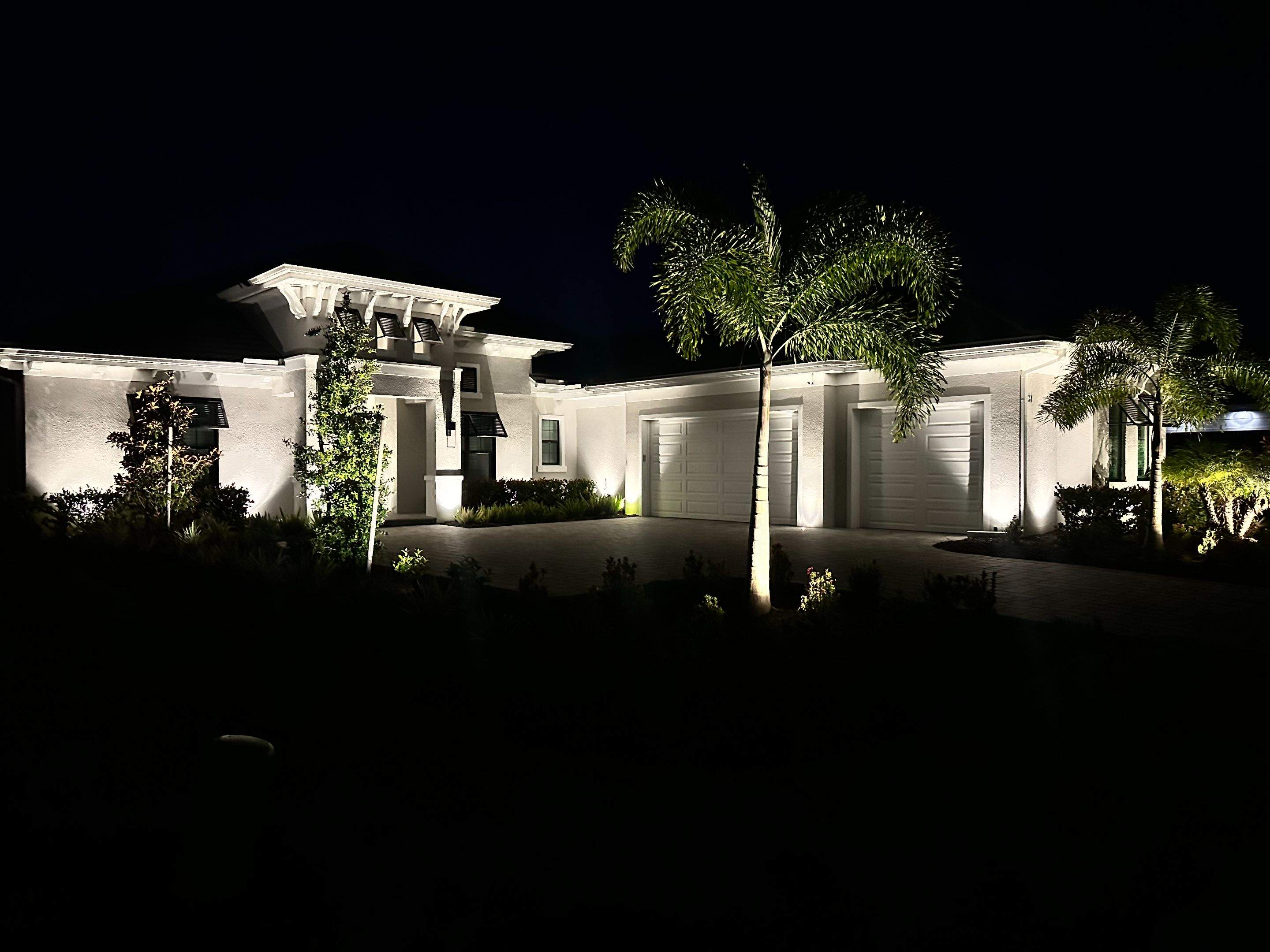Architectural and Landscape Lighting Installation for Modern Sarasota Home by Illuminate Landscape Designs