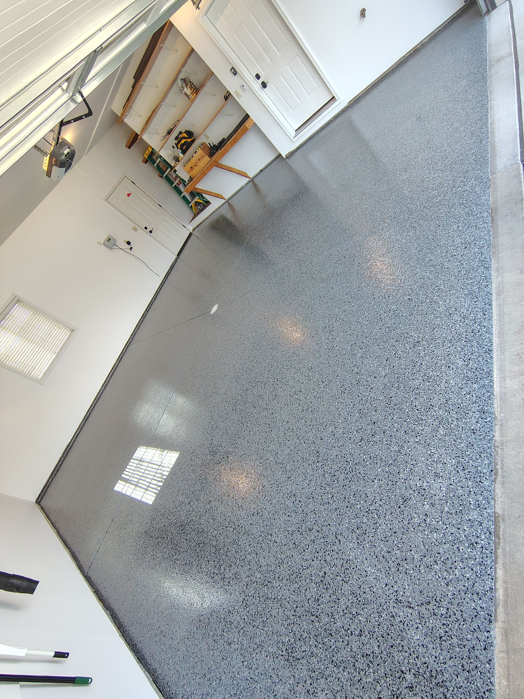 Grey Speckled Epoxy Garage Floor Coating in Sioux Falls by Select Painting, Coatings & Garage Cabinets