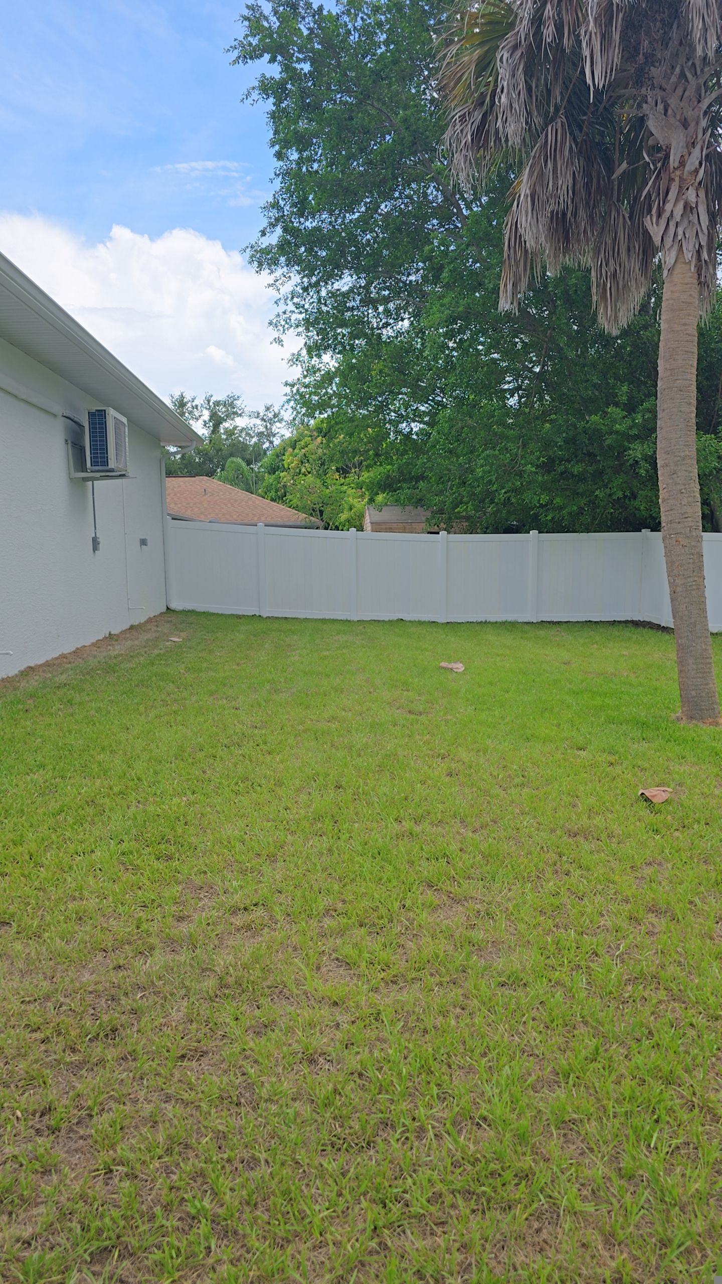 White Vinyl Privacy Fence Installation and Gate Repair in Port Charlotte by True Fence LLC