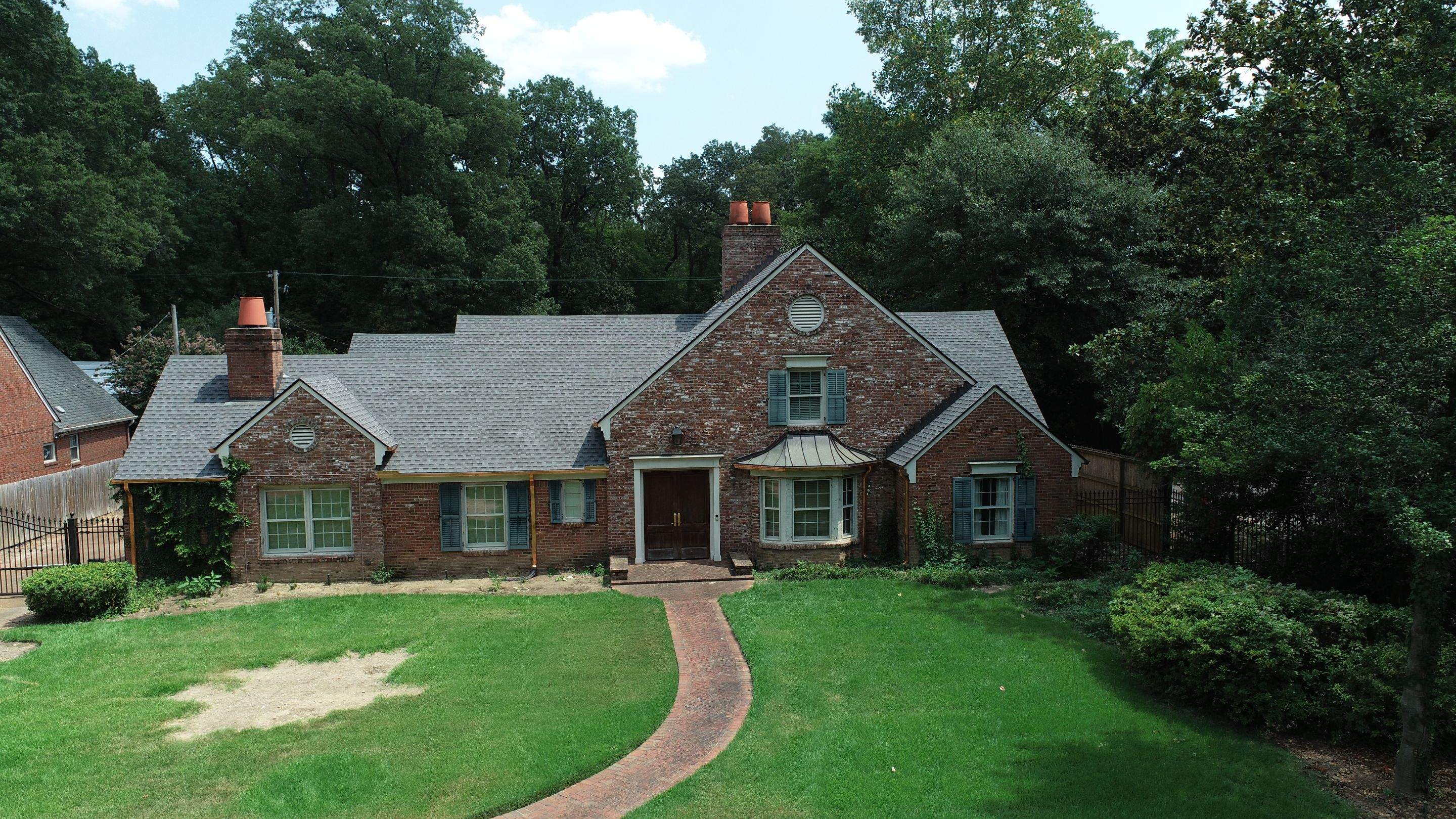 Full Roof Replacement with gutter upgrade after tree impact damage in East Memphis by Revival Roofing Services