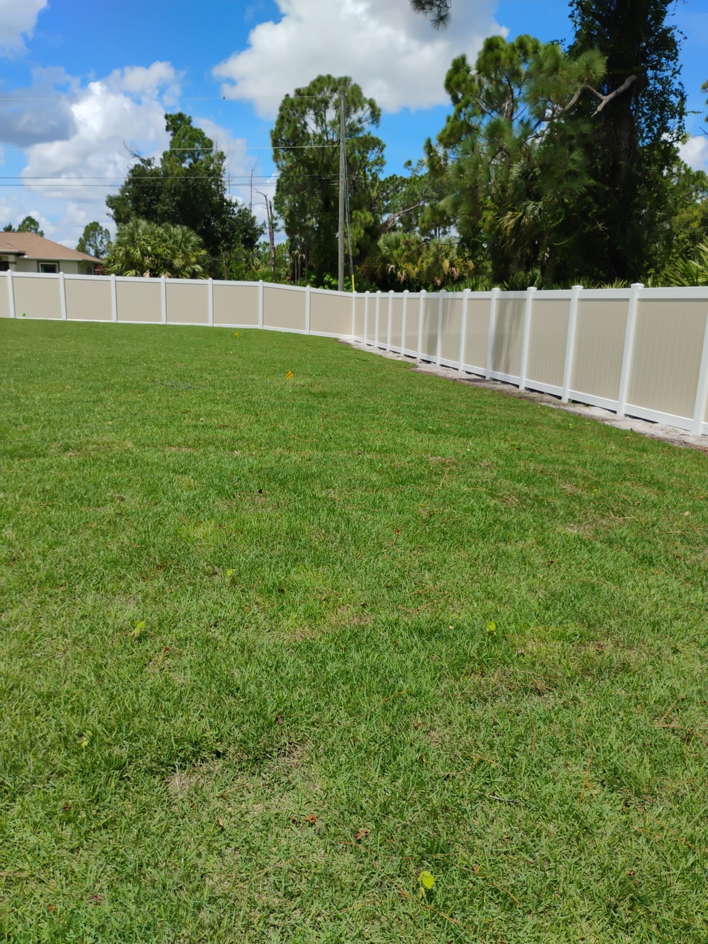 Custom Two-Tone Vinyl Privacy Fence Installation in North Port by True Fence LLC