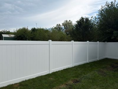 White Vinyl Privacy Fence Installation in Raymond, IA