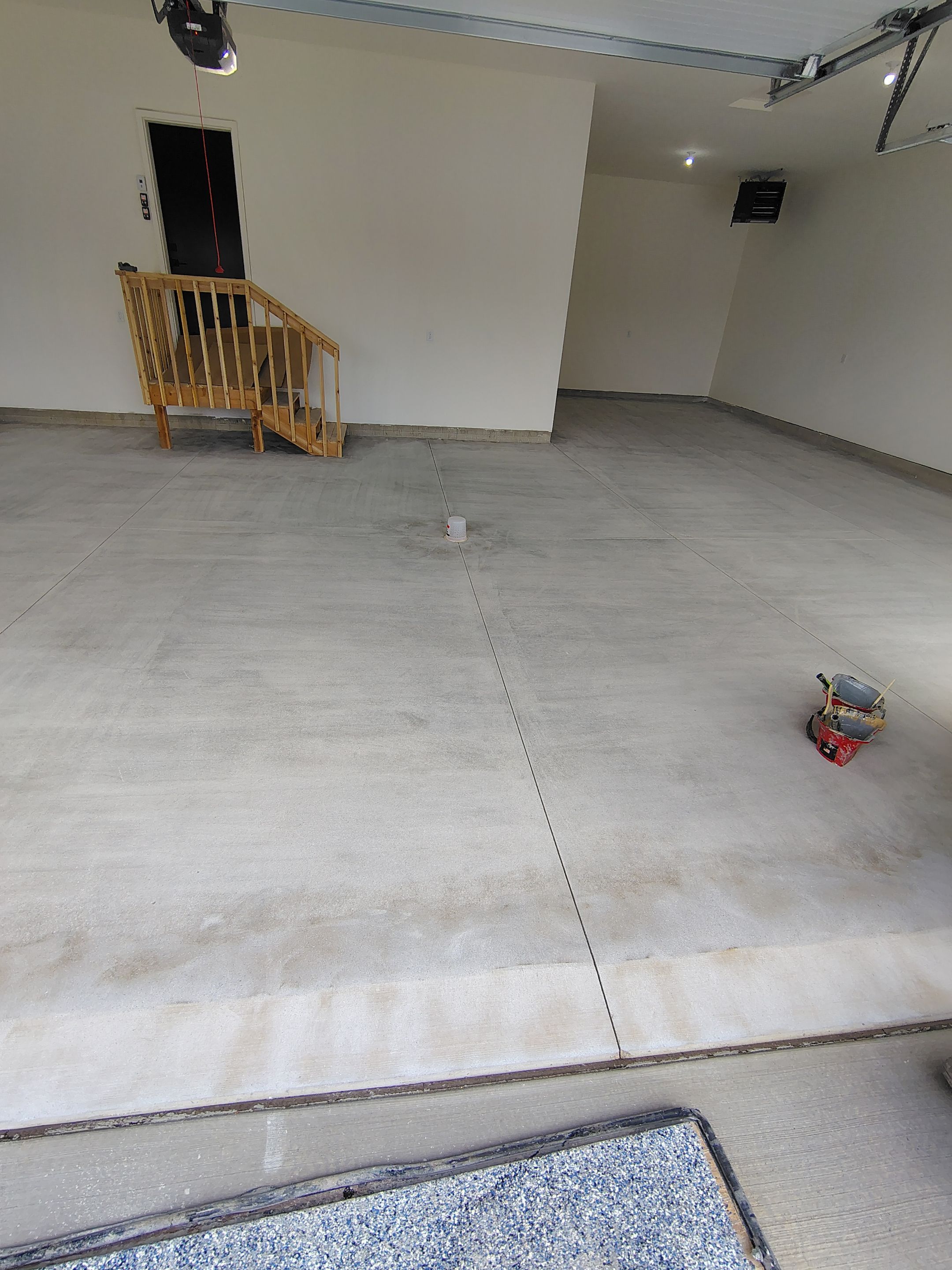 Sioux Falls Garage Floor Transformation with Gray Decorative Flake Coating by Select Painting, Coatings & Garage Cabinets