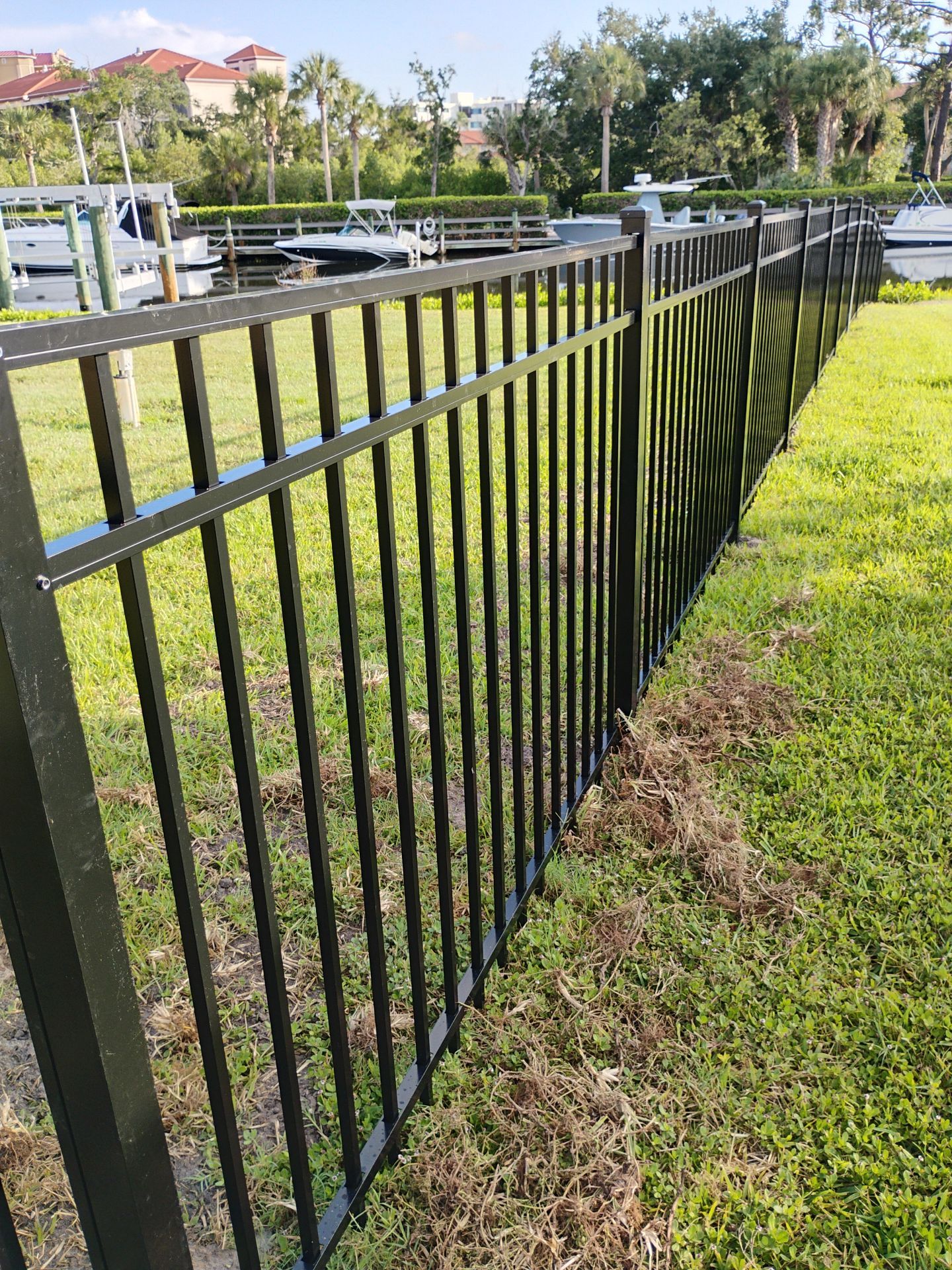 Black Aluminum Waterfront Fence Installation in Osprey by True Fence LLC