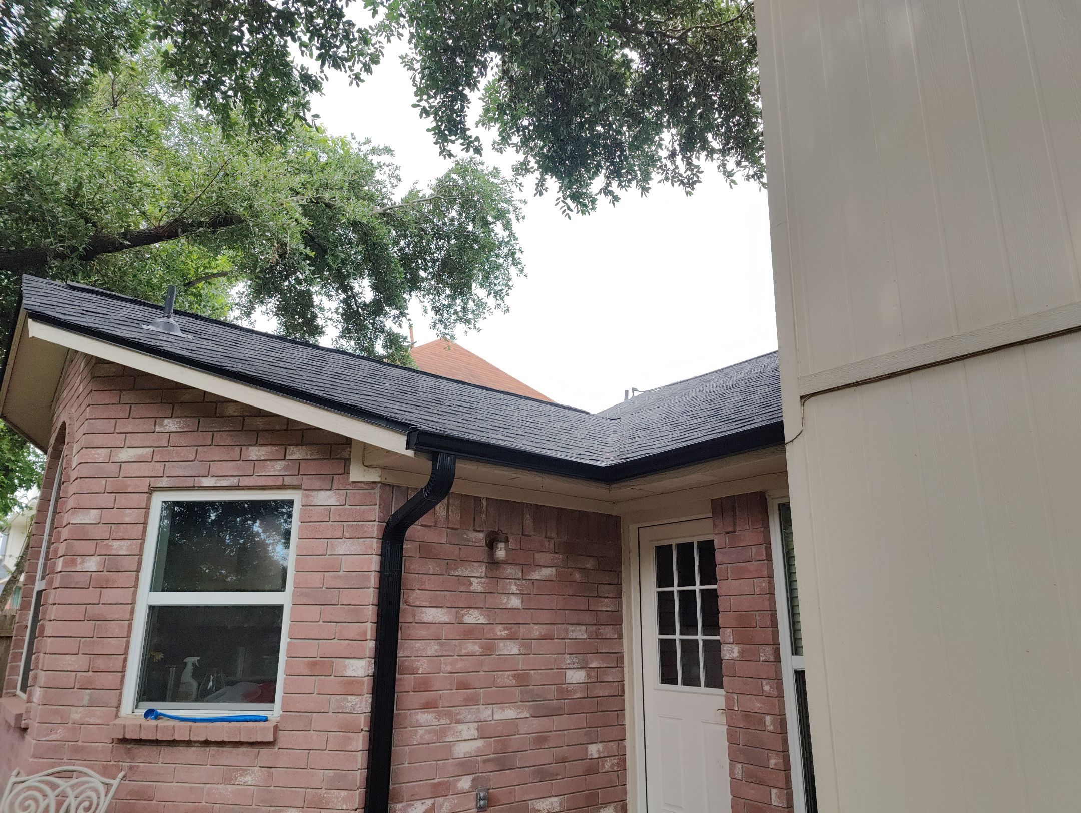 Residential Roofing Installation using IKO Dynasty Class 3 IR Granite Black by DeZign Roofing & Exteriors
