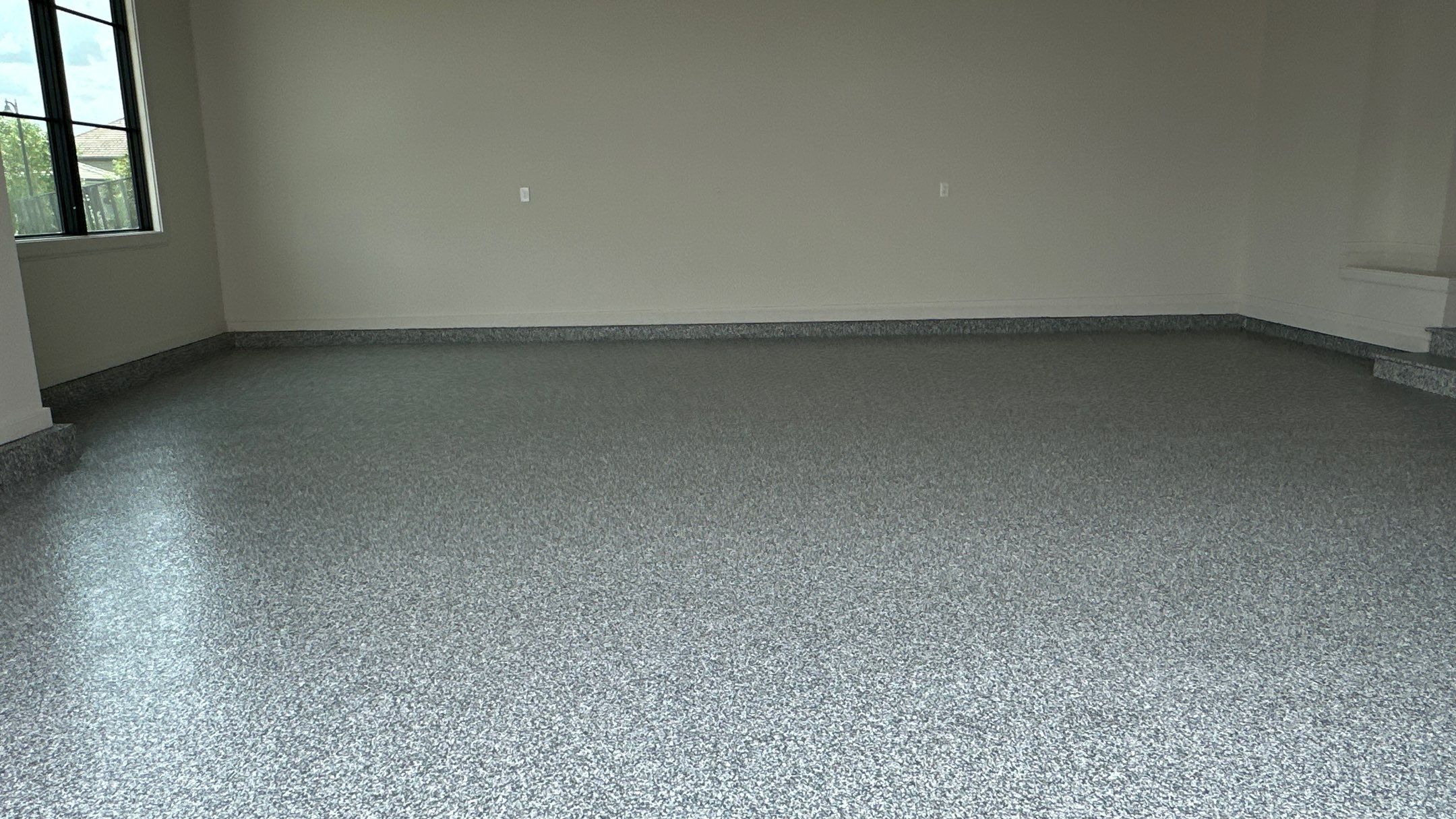 Check out how beautiful a brand new stonehenge flake floor looks by Banner Garage