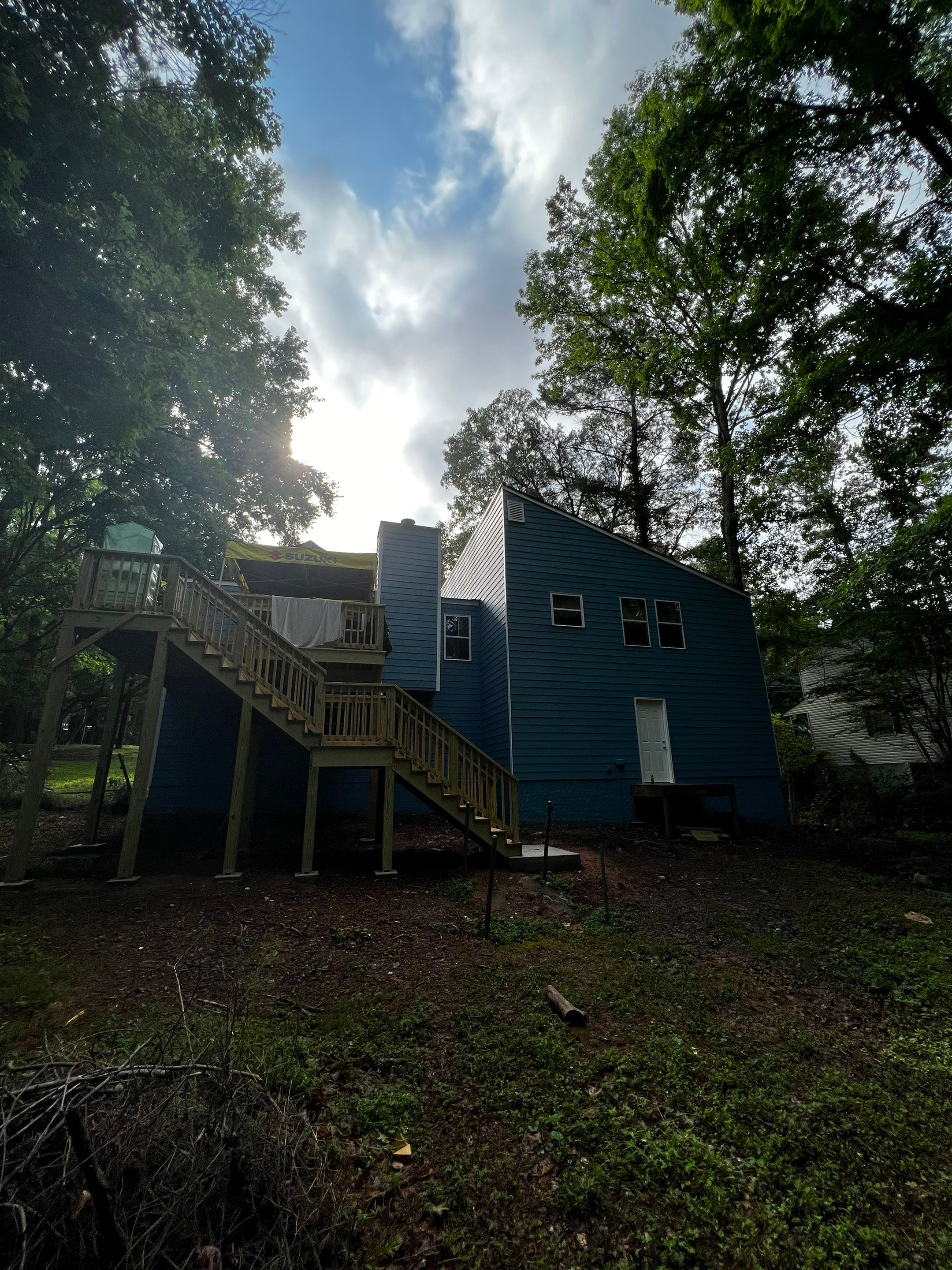 Elevated Wood Deck and Blue Lap Siding Installation in Kennesaw by Swift Home Renovations