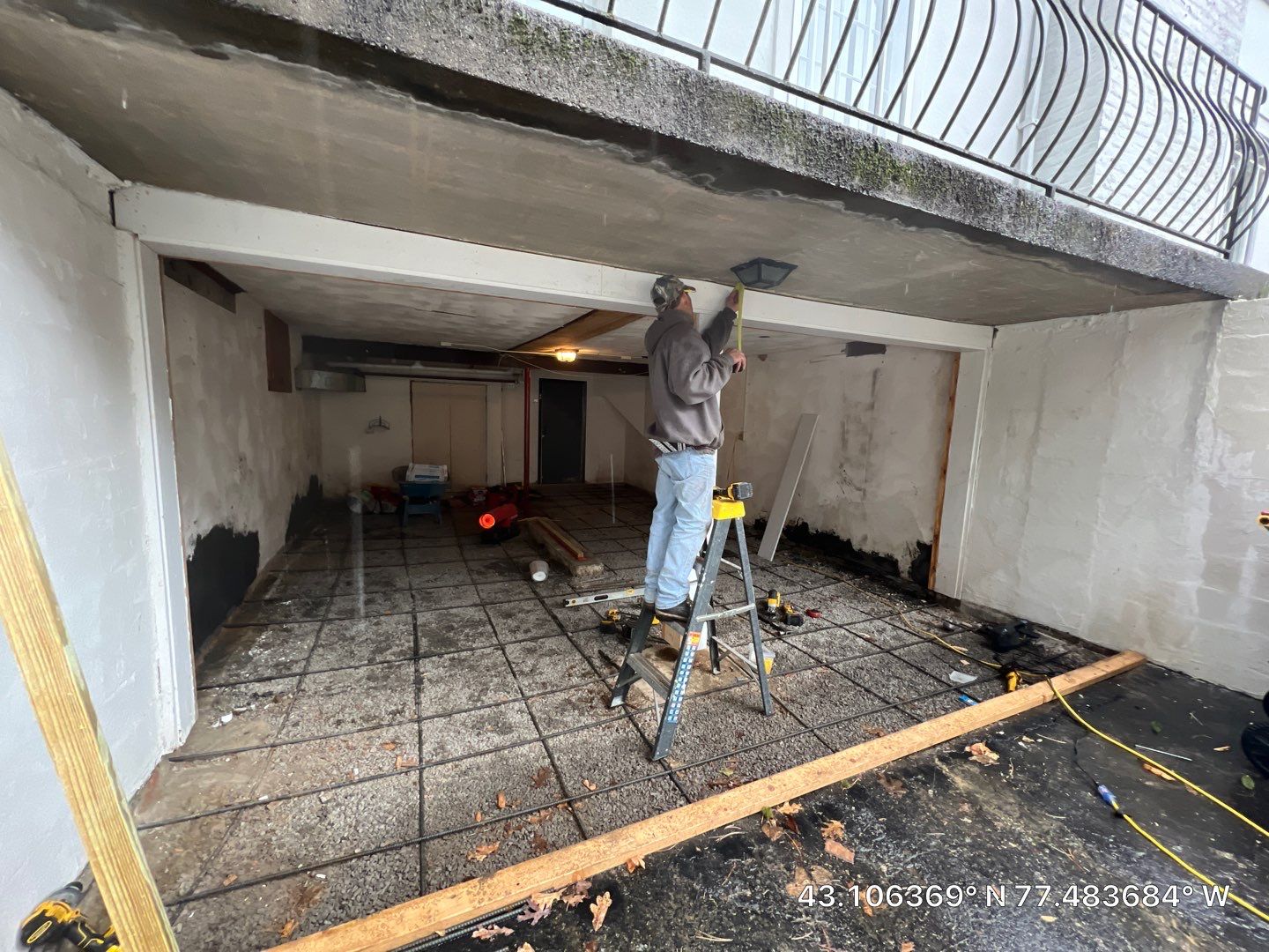 Concrete garage floor replacement with a broom finished apron and wall repair by NG Masonry & Construction LLC