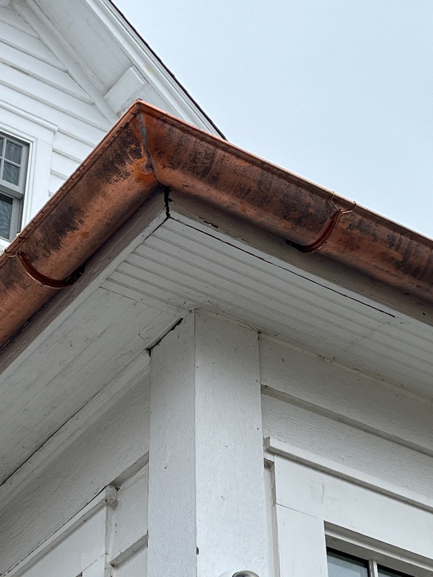 Asphalt Roof Replacement with Half Round Copper Gutter Installment by Custom Installations