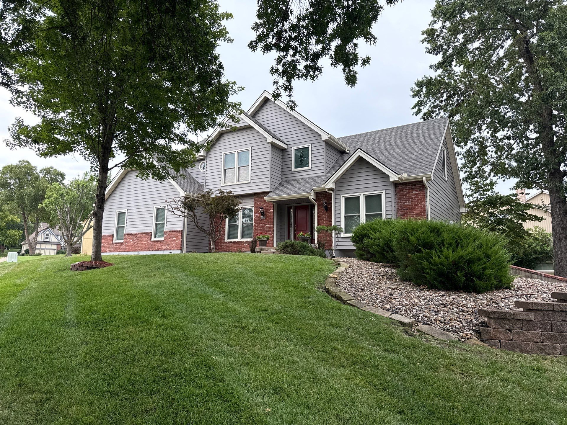 Whole Home Siding Replacement and Gutter Installation in Gladstone by EEC  Windows, Siding & Roofing 