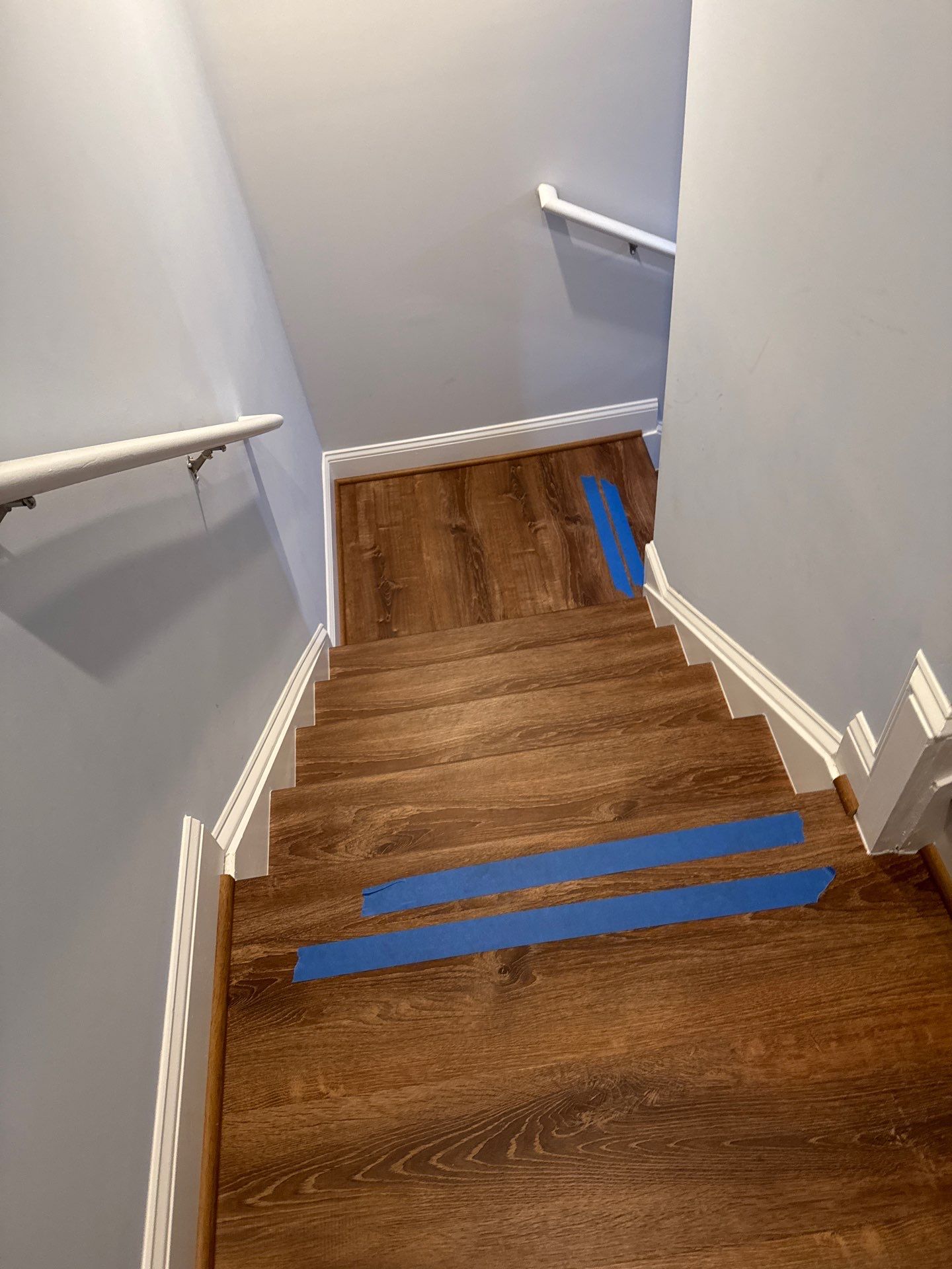 Stairway Installation using t vinyl stair tread and reversibleriser by La Bendicion Contruction Llc