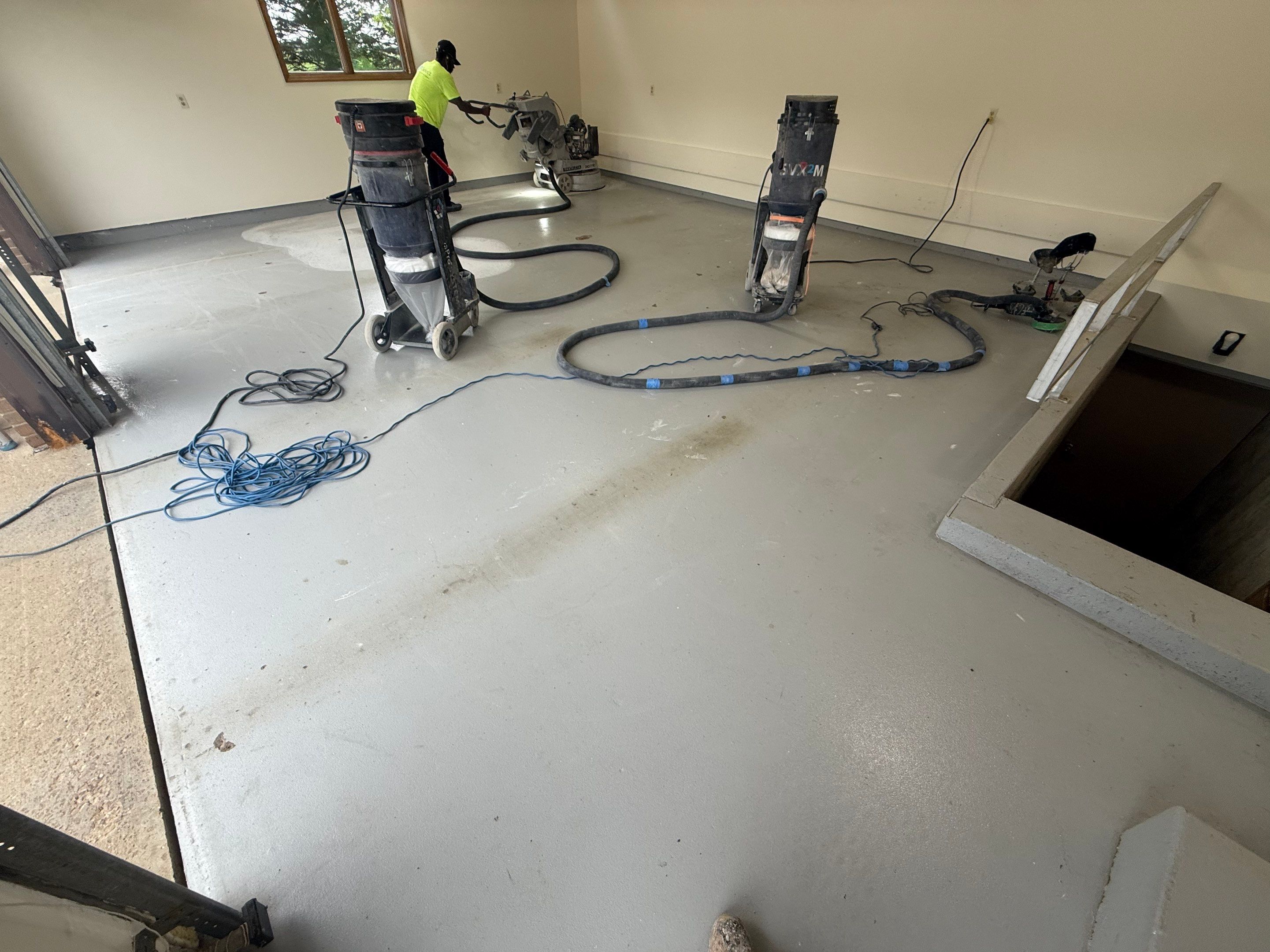 Custom Polyaspartic Garage Floor and Stairwell Coating in Pipestone by Select Painting, Coatings & Garage Cabinets
